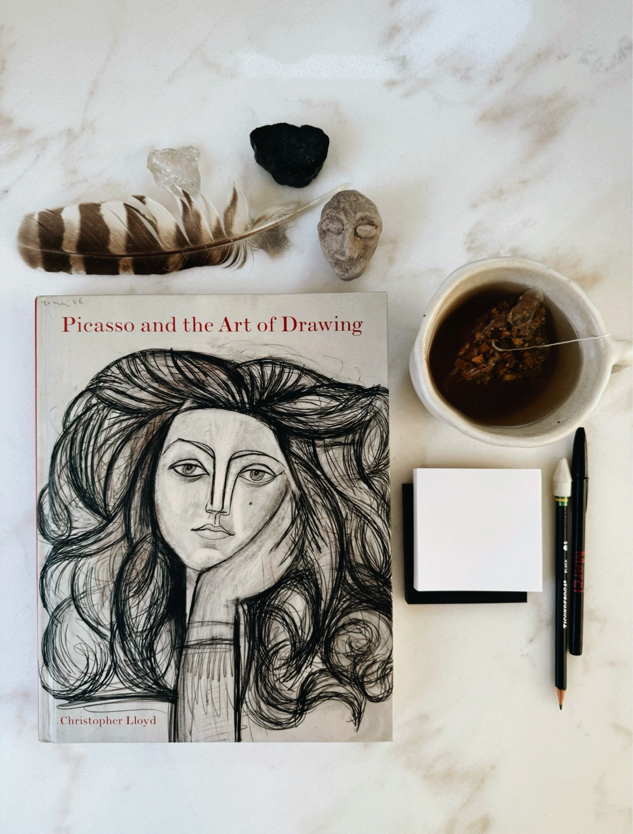 Picasso and the Art of Drawing by Christopher Lloyd art book on studio table.