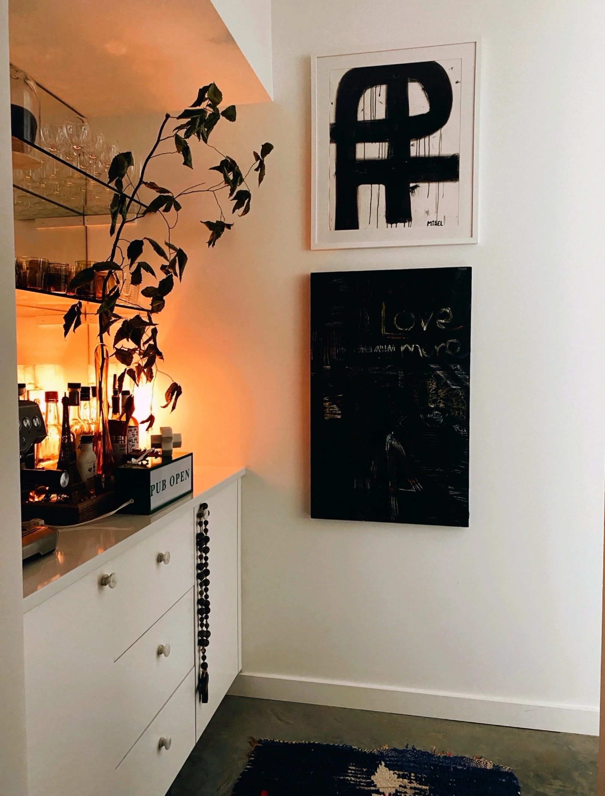 bar/coffee station with black and white art from the home of artist and designer michel van devender