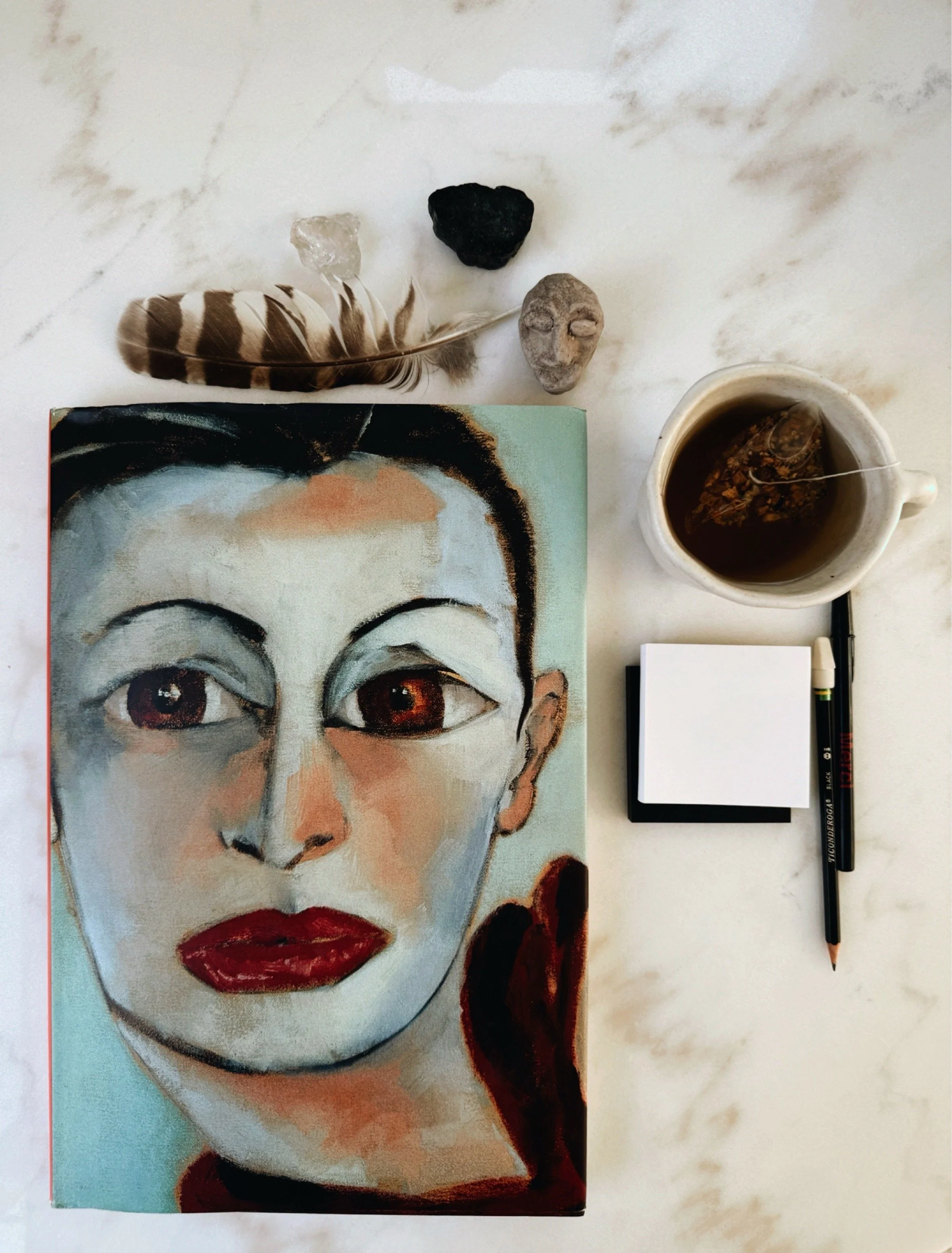 Life Is Paradise: The Portraits of Francesco Clemente by Francesco Clemente and Vincent Katz art book on studio table.