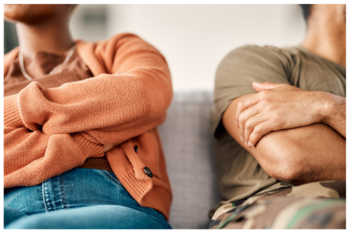 Couple arguing with each other turning away in counseling