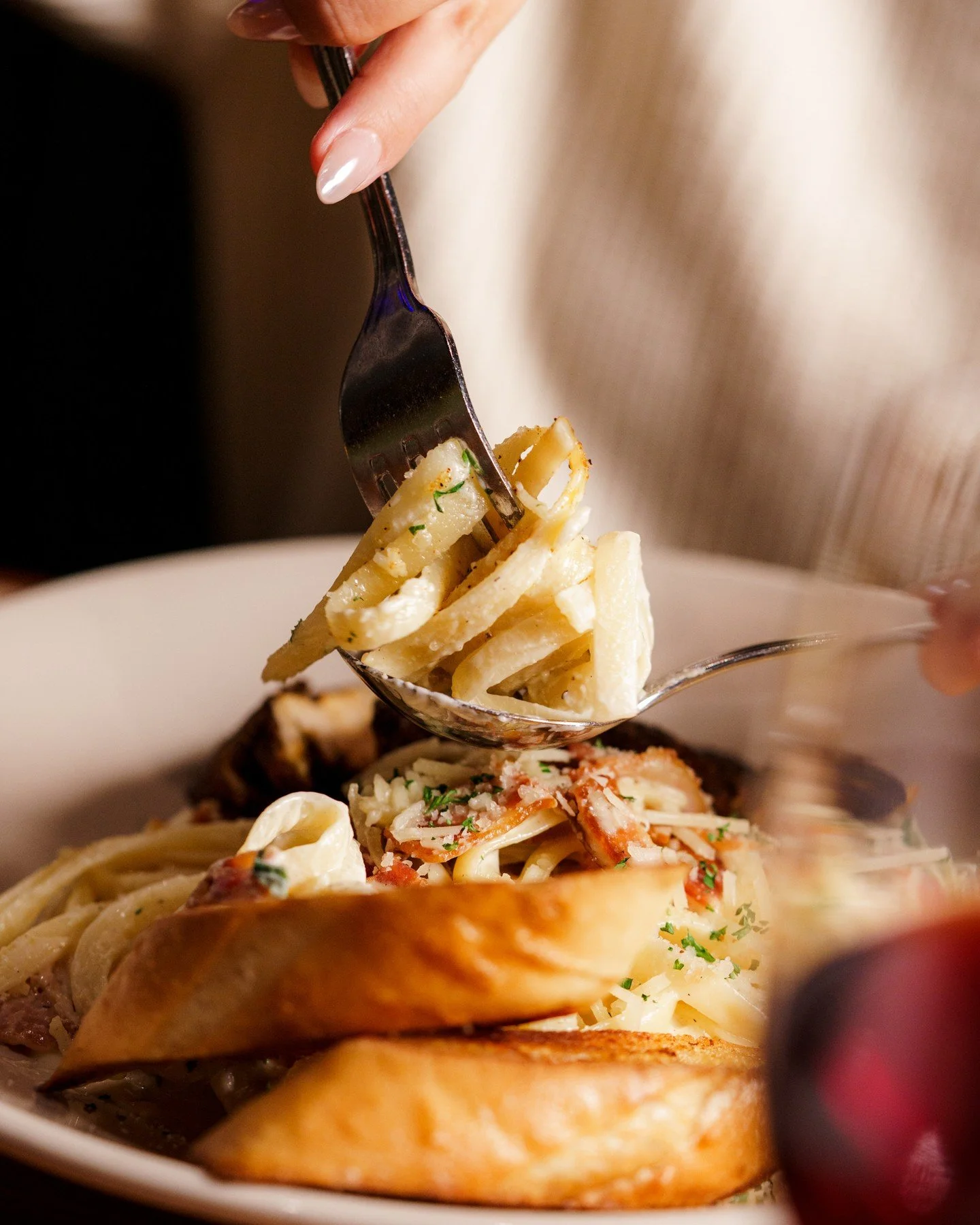 Is this a forkful or a spoonful? It won't matter when the Blackened Chicken Alfredo leaves you full!

Blackened Chicken Fettuccine Alfredo: Bacon, roasted garlic cream, aged padano, garlic toast.