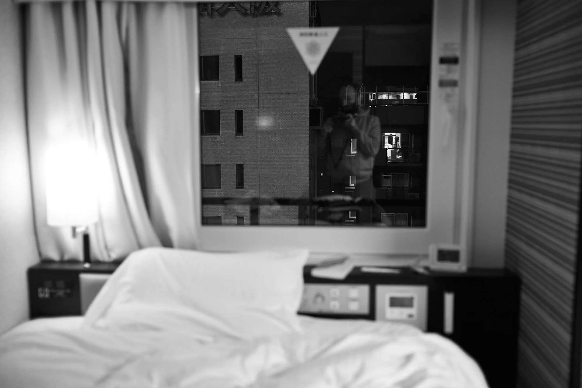 Photograph of a quarantine hotel room in Osaka, Japan by Xavier Andujar.