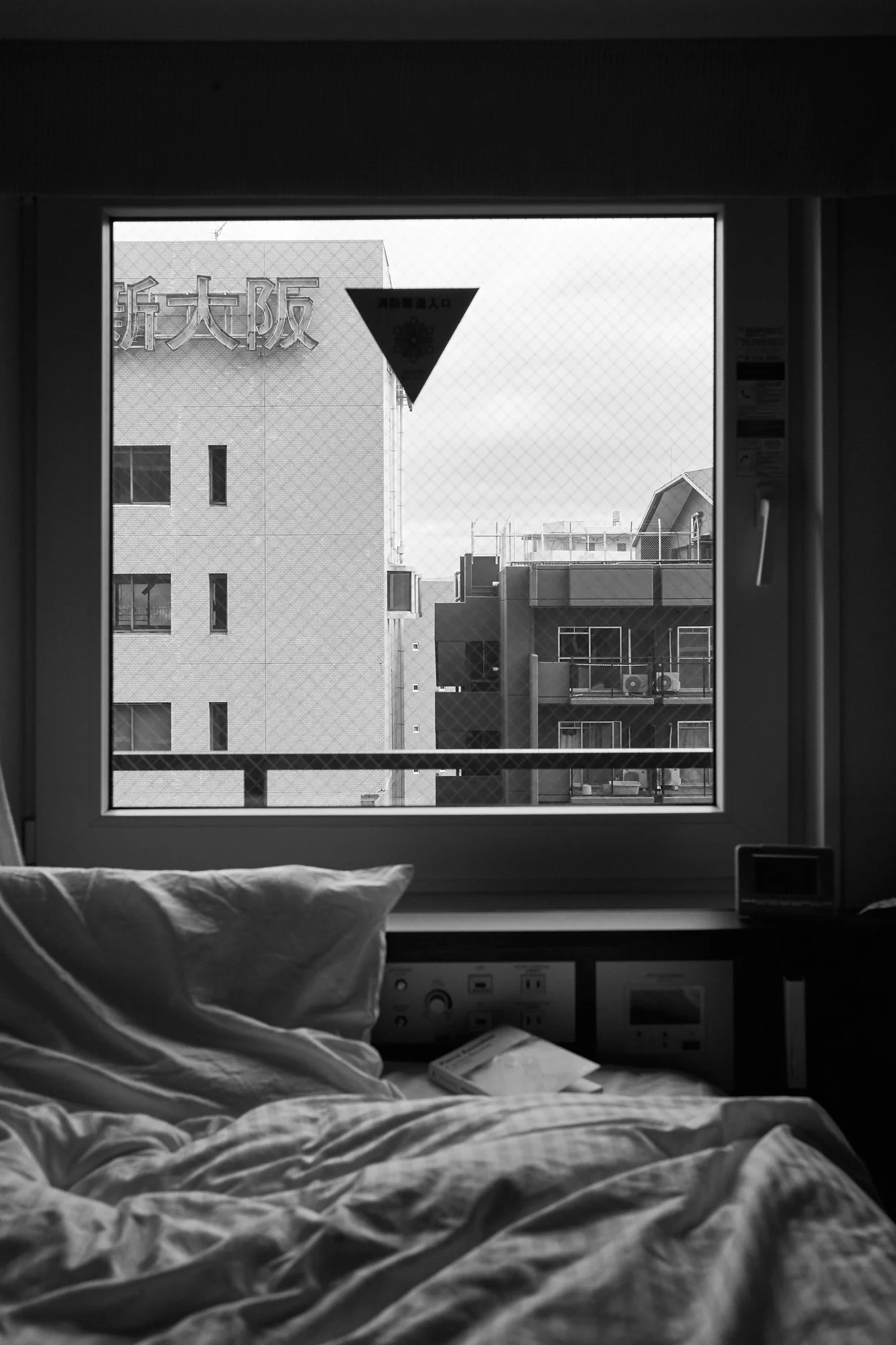 Photograph of a quarantine hotel room in Osaka, Japan by Xavier Andujar.