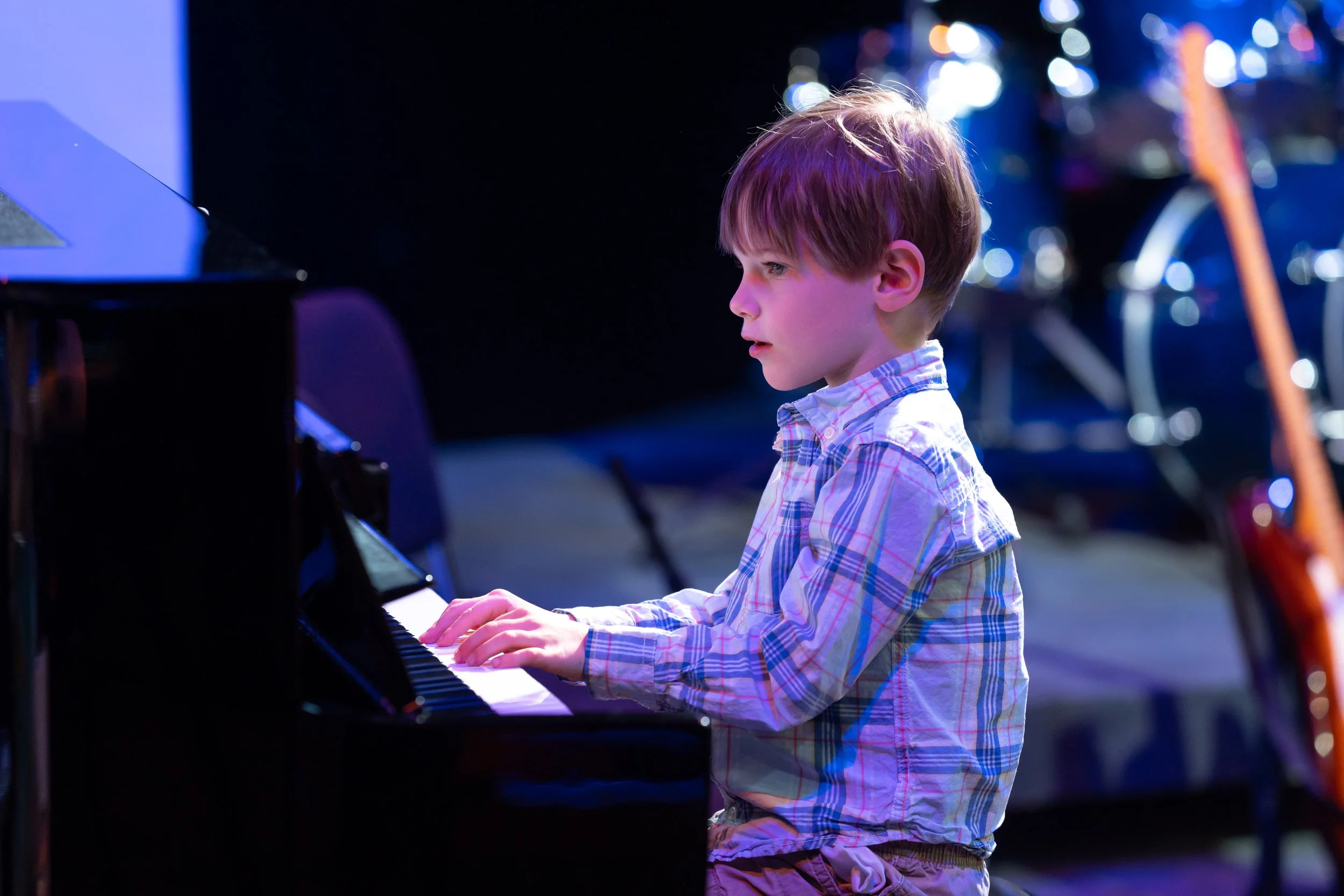 Young boy playing piano