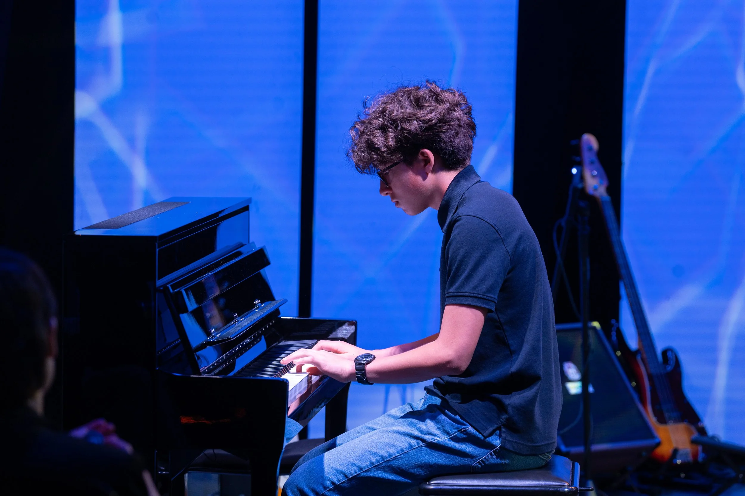 Teenage boy plays piano