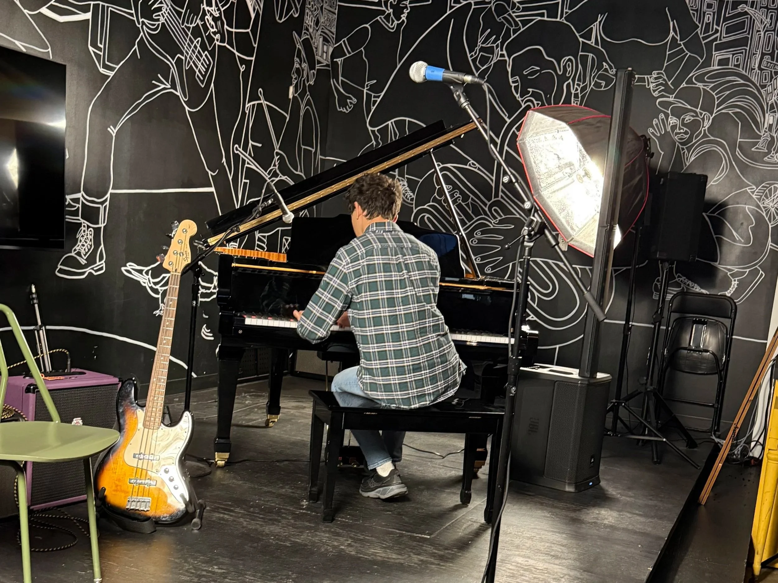 High school student plays grand piano