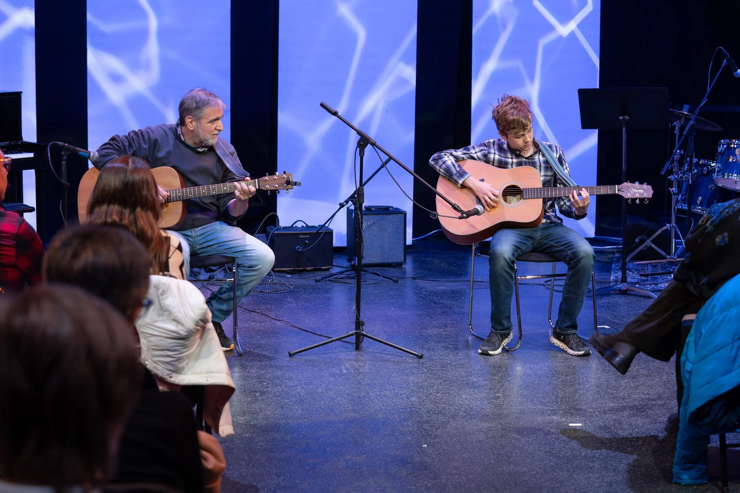 Guitar teacher, Brian Jablo, and his student perform a duet