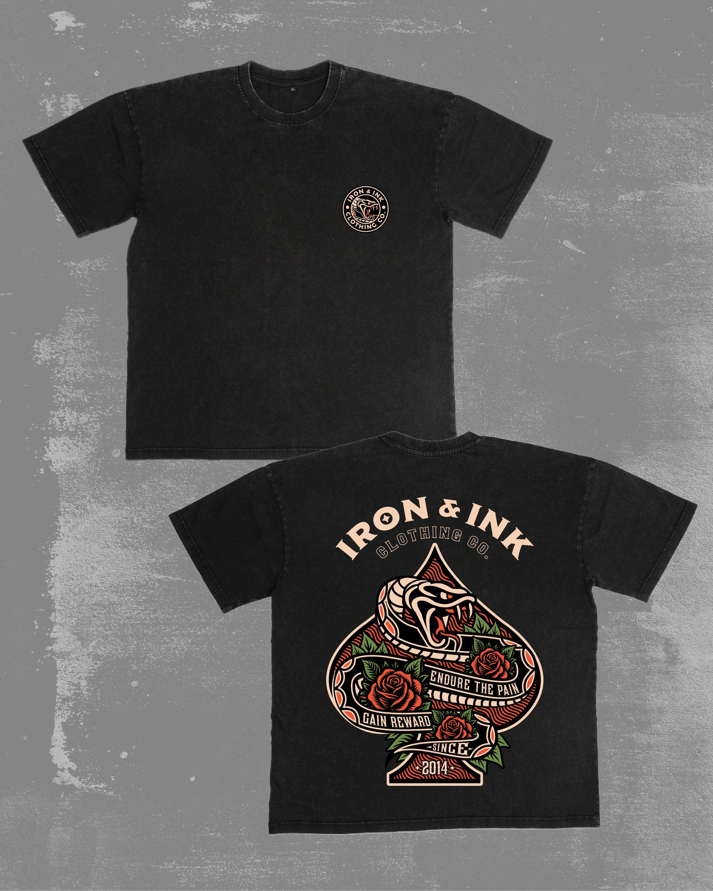 Black graphic t-shirt featuring a small circular logo on the front chest with the text 'Iron & Ink Clothing Co.' and a stylized animal head inside a circle. The back of the shirt displays a large colorful spade symbol with a snake, roses, and text th