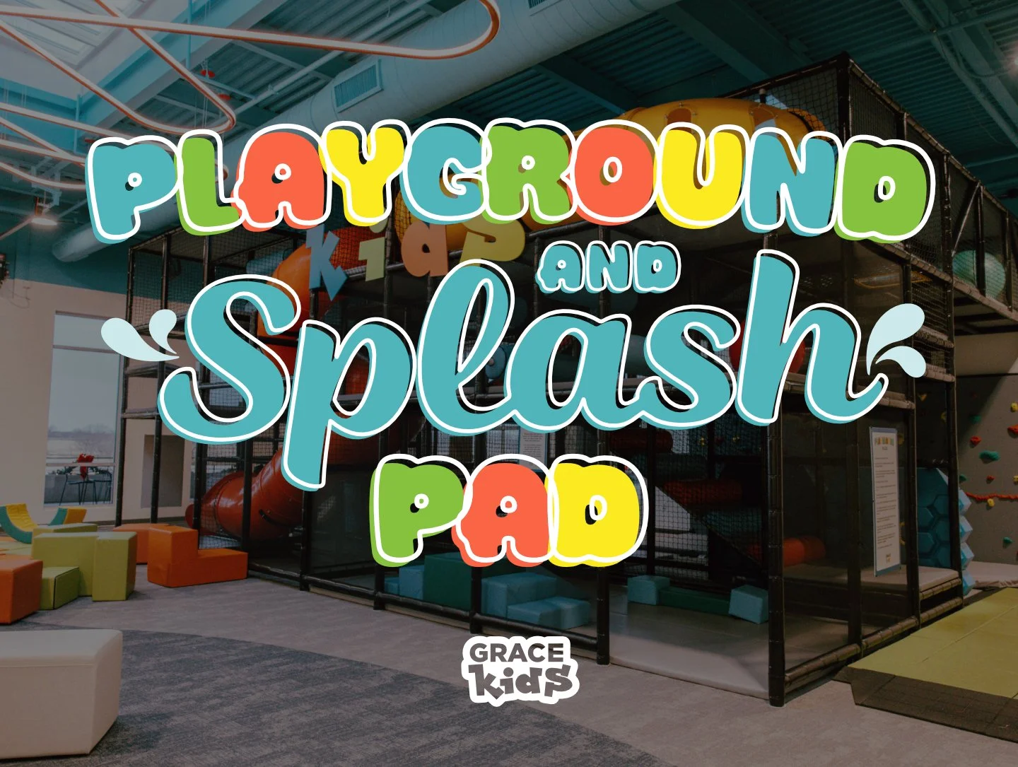 Interior of a children's play area with colorful foam blocks and a large black climbing structure with a slide, advertising 'Playground and Splash Pad' by Grace Kids.