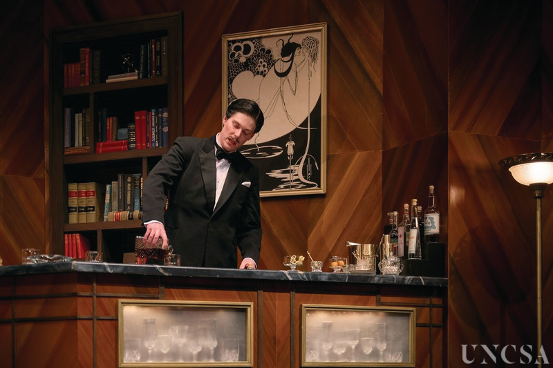 Bar set dressing for Dangerous Corner. Pictured: Logan Gould (UNCSA '23) 