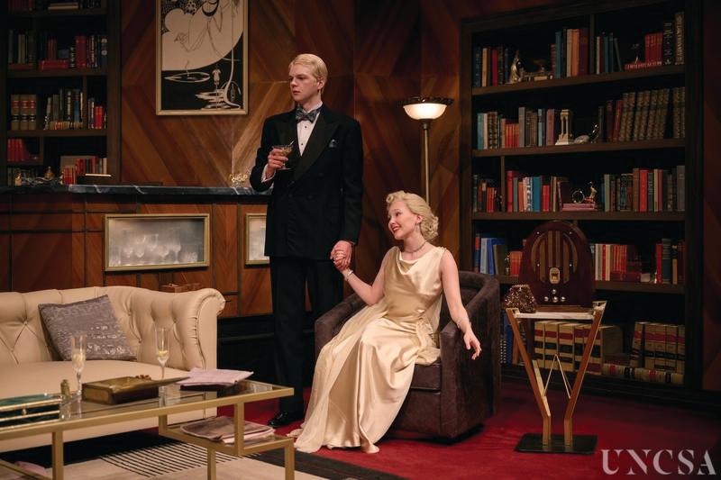 Living room and Bookshelf set dressing from Dangerous Corner (UNCSA '23) Pictured: Hunter McCoy and Ferin Bergen