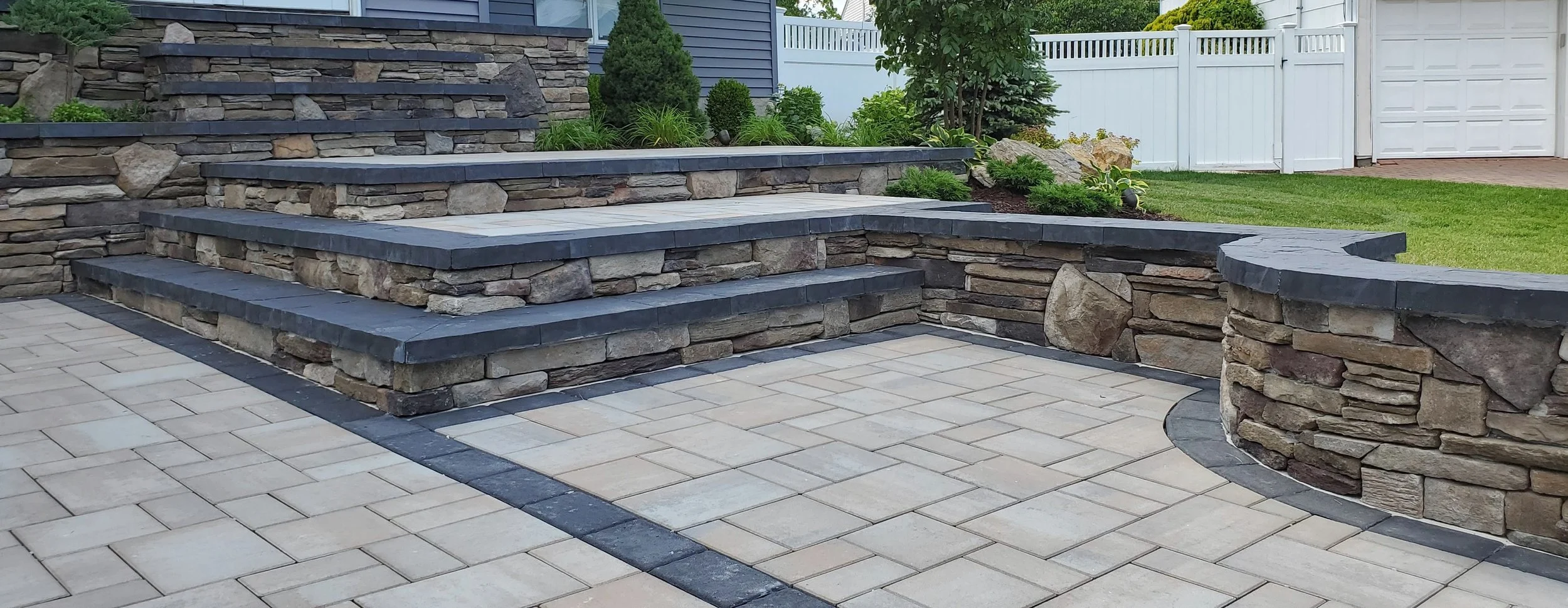 Stone stoop and paver walkway & driveway