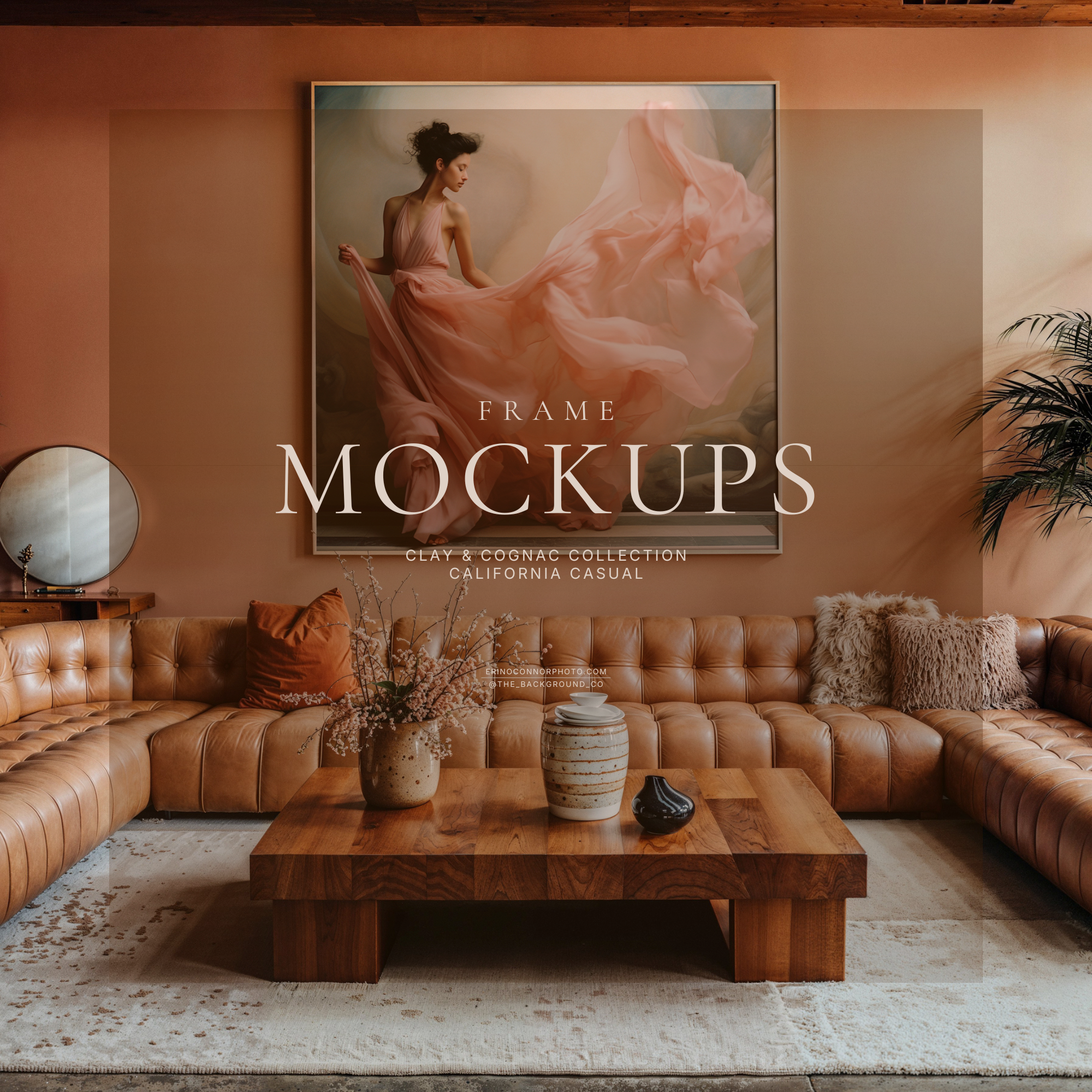 California casual living room frame mockup with terracotta clay wall, cognac leather sectional, large square frame, warm light, plants and wood coffee table.
