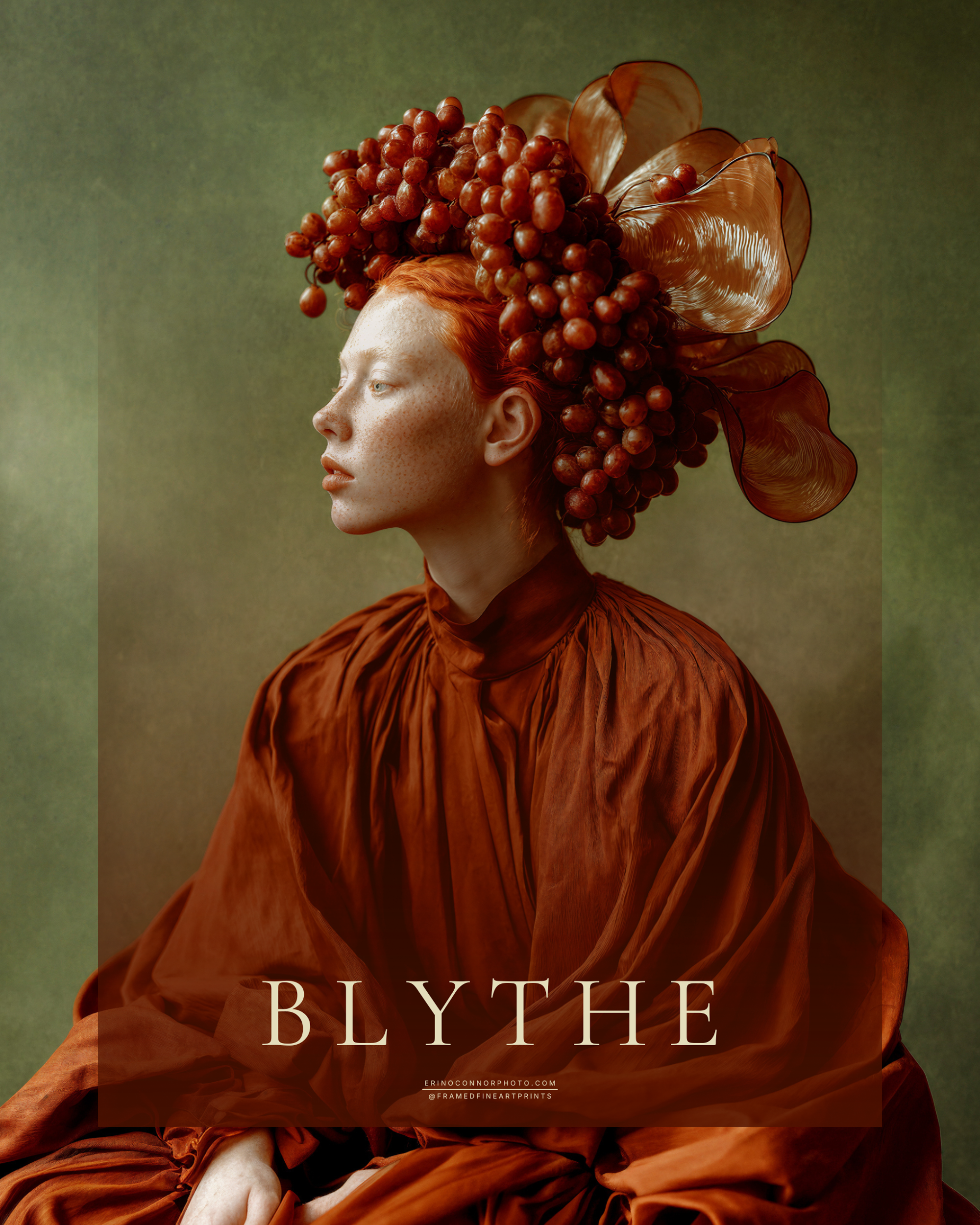 Blythe fine art portrait of a red-haired woman in a rust-colored gown wearing an elaborate headdress of red grapes and translucent amber leaves.