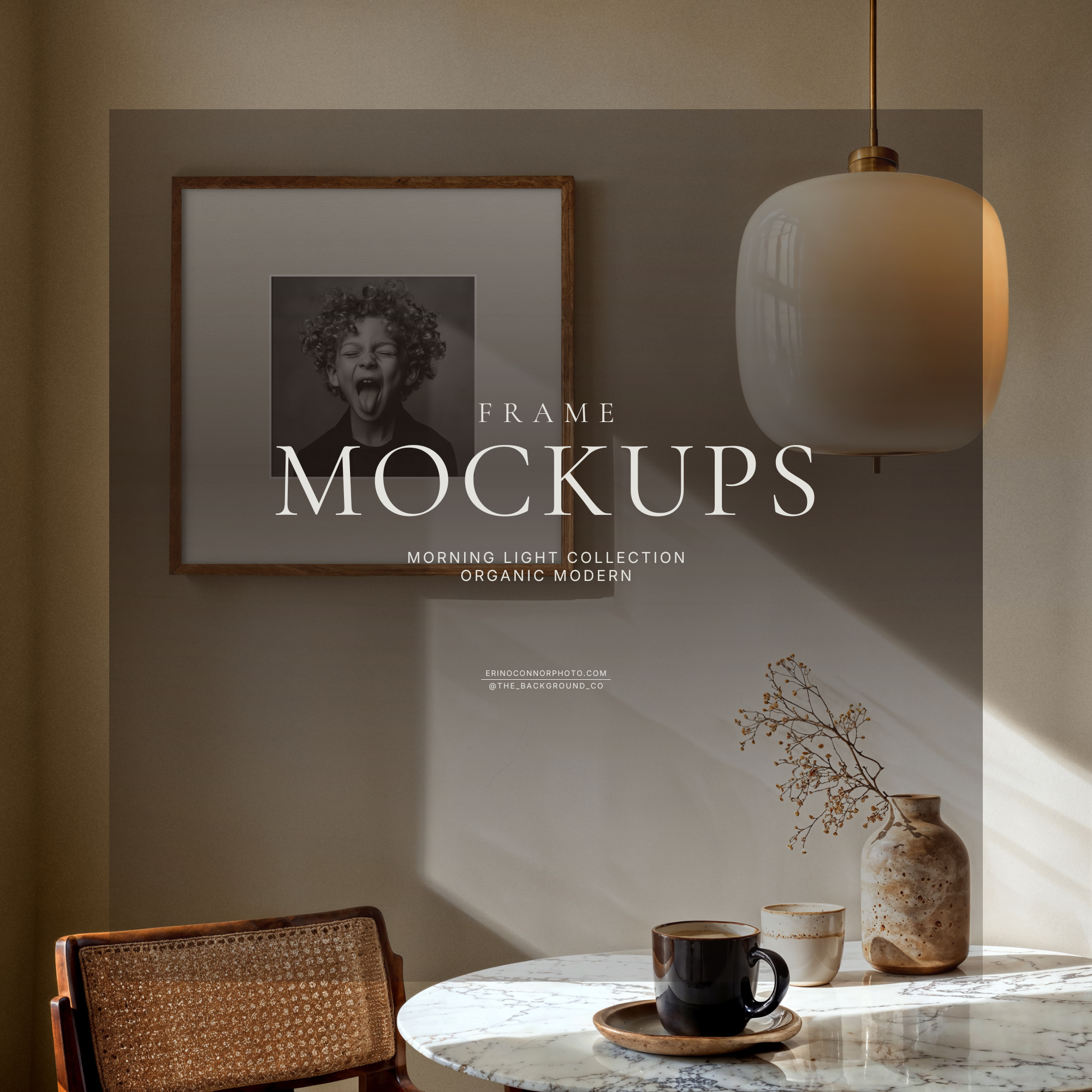 Organic modern corner mockup with round marble table, cane chair, warm neutral wall, oversized pendant light, and a square wood frame with wide white matte in sunlit shadows.