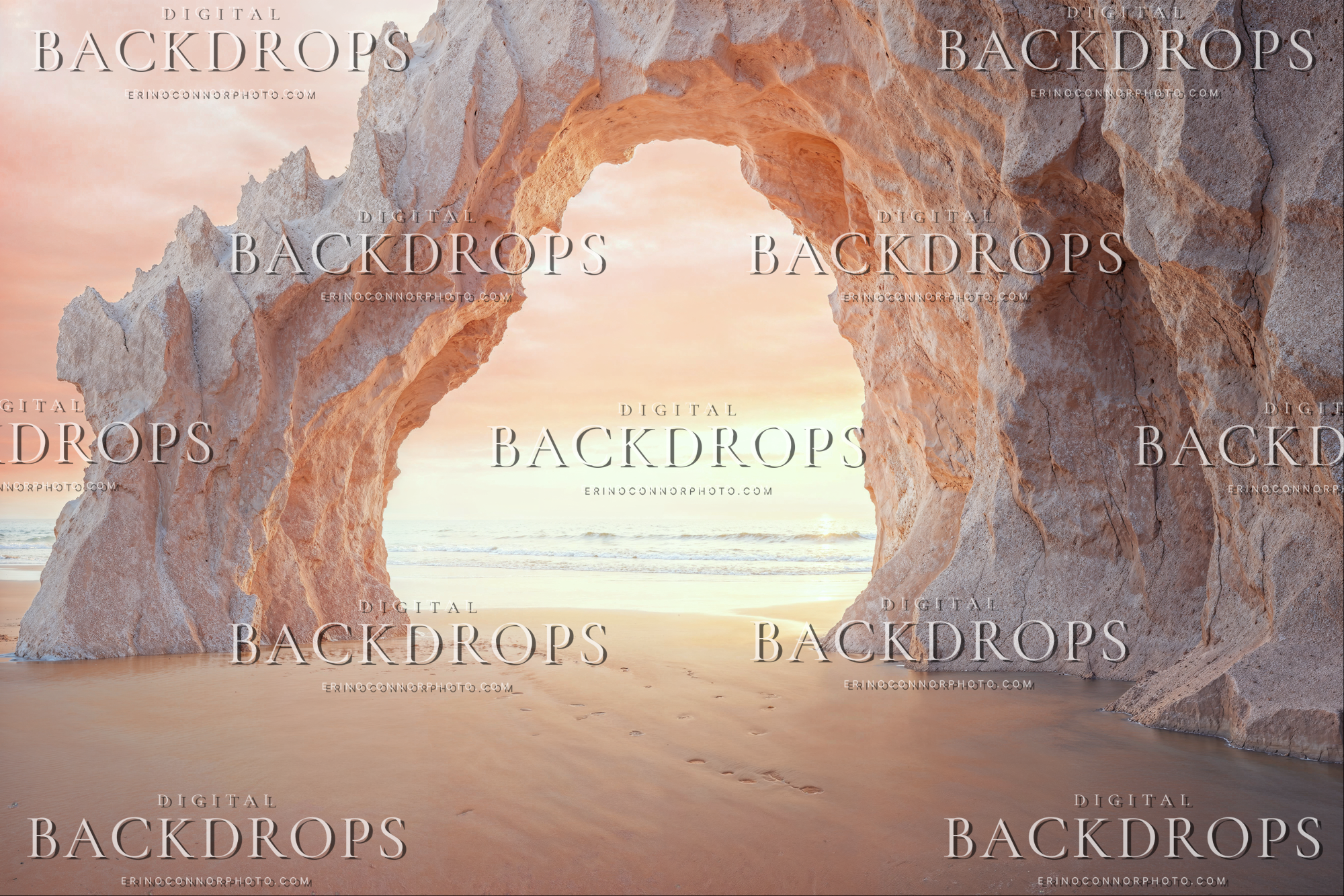 Sunset Beach Arch Blush Horizon digital backdrop showing a pale stone beach arch opening toward the ocean at sunrise with blush sky, smooth sand, and soft coastal light.