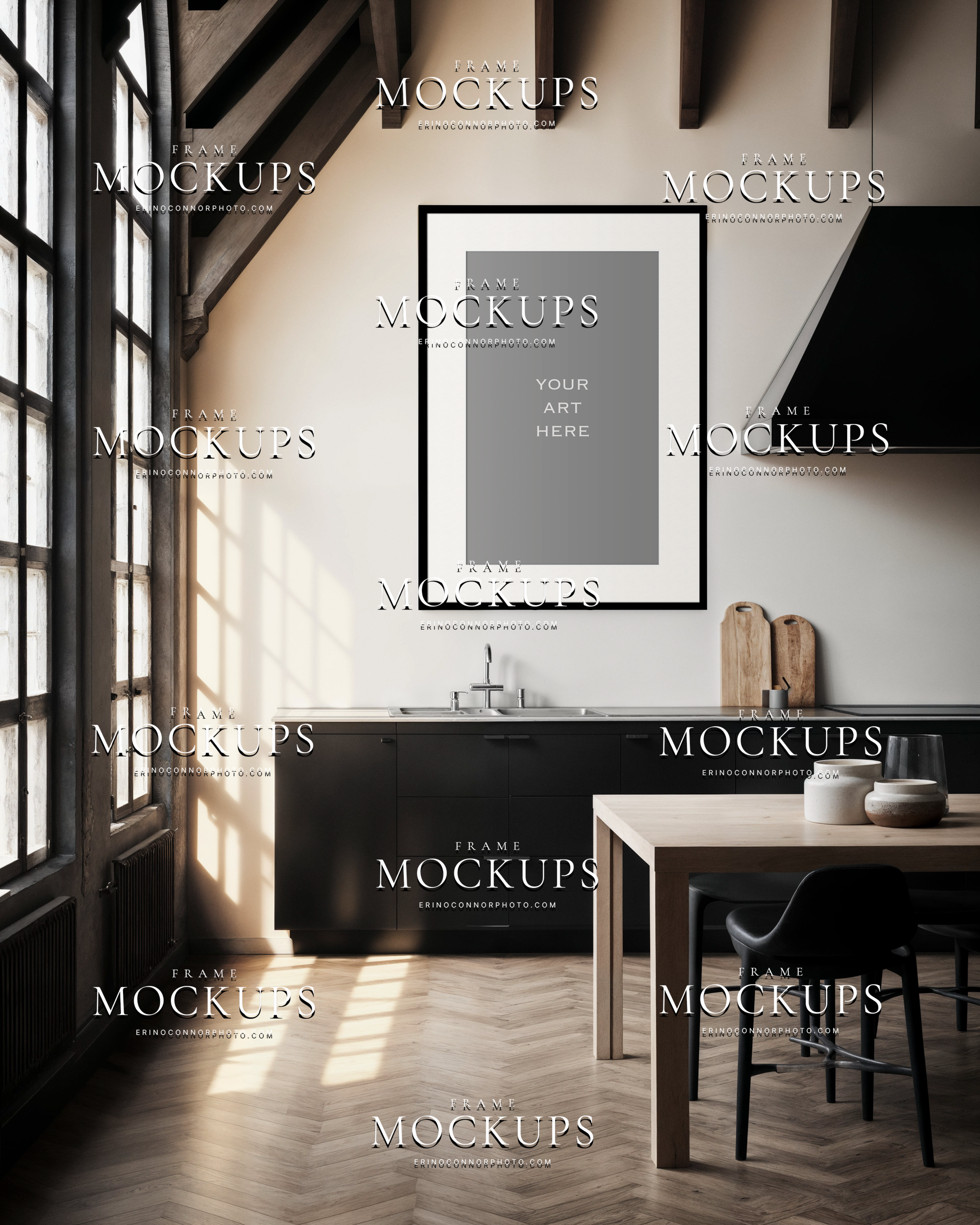 Empty vertical kitchen wall art mockup in a rustic modern A-frame cabin with black cabinetry, tall windows, exposed beams, herringbone floor, and warm natural light