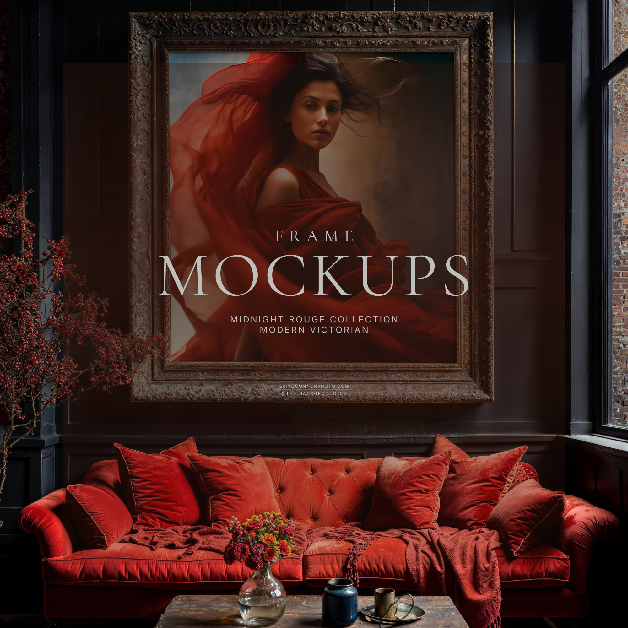 Moody room mockup with red velvet sofa, charcoal paneled wall, ornate distressed frame mockup above couch, styled pillows and coffee table, designed to showcase artwork on a real wall.