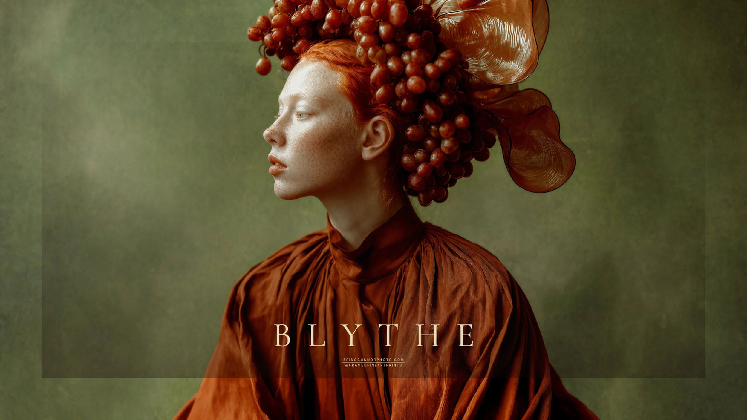 Blythe in profile wearing a sculptural red grape headdress and flowing rust-colored clothing against a muted olive background.