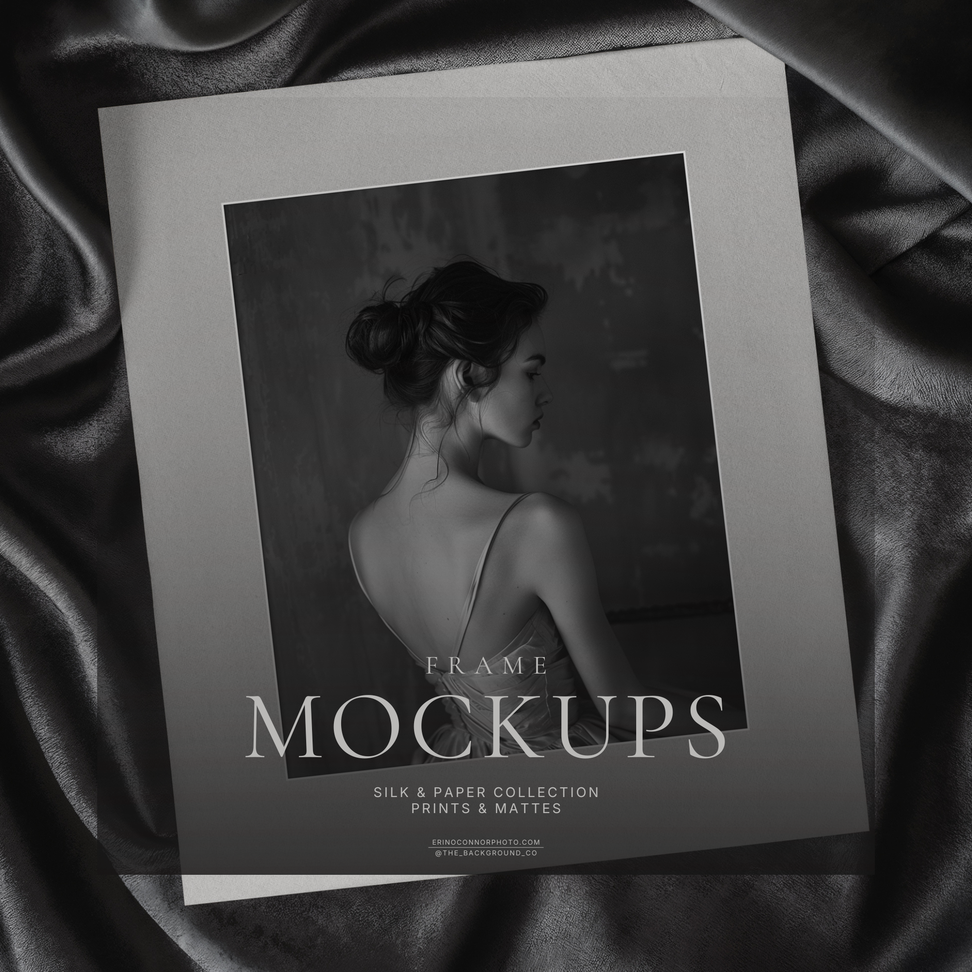 Dark charcoal satin flat lay with an angled matted photo print and square art placeholder, moody fine art print mockup for photography and artwork displays.