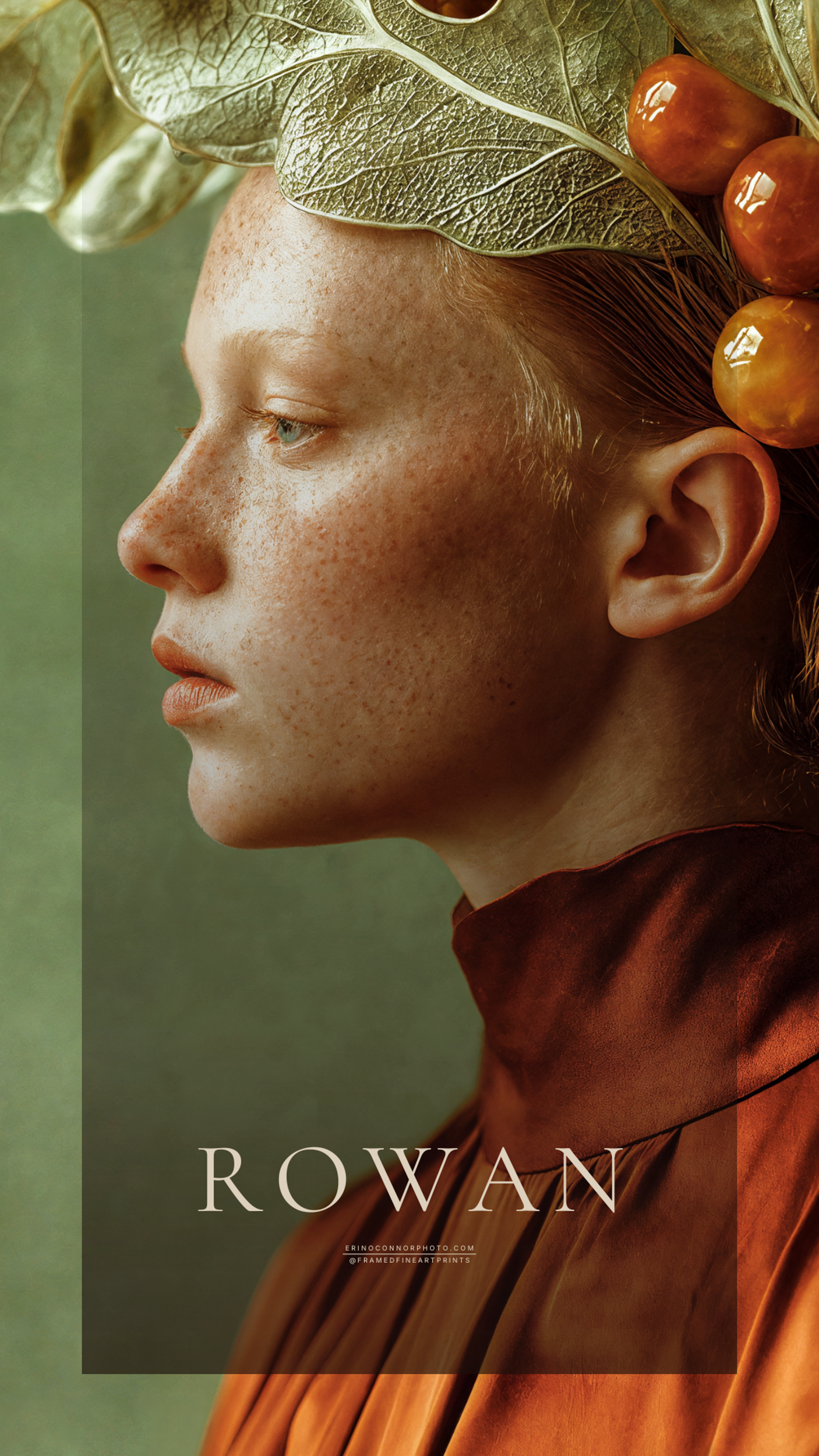 Close profile portrait of Rowan with freckled skin, red hair and an elaborate botanical headdress of fig leaves and fruit.