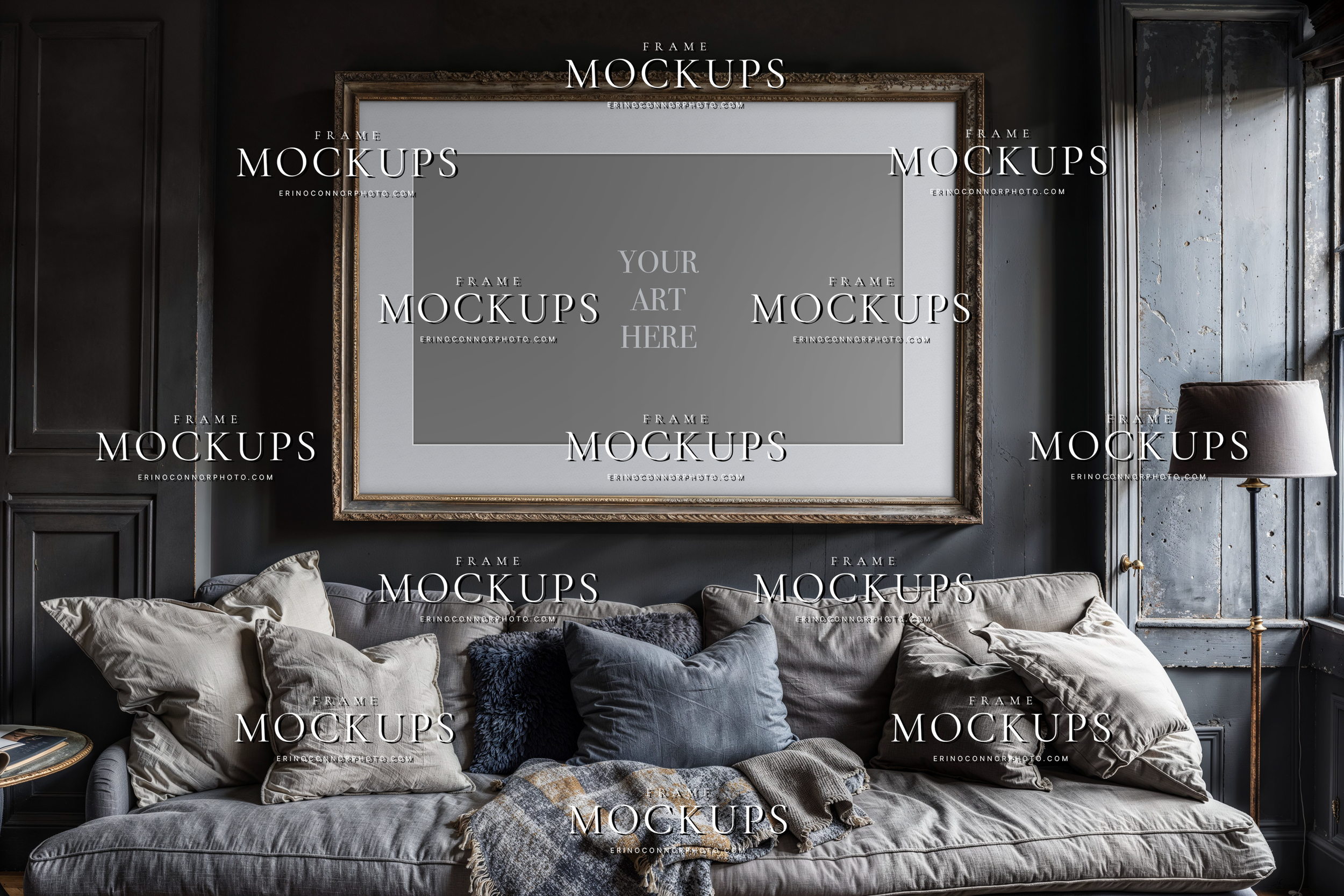 Empty horizontal wall art mockup in a moody vintage interior with dark painted walls, grey sofa, antique frame, floor lamp, and relaxed heirloom styling