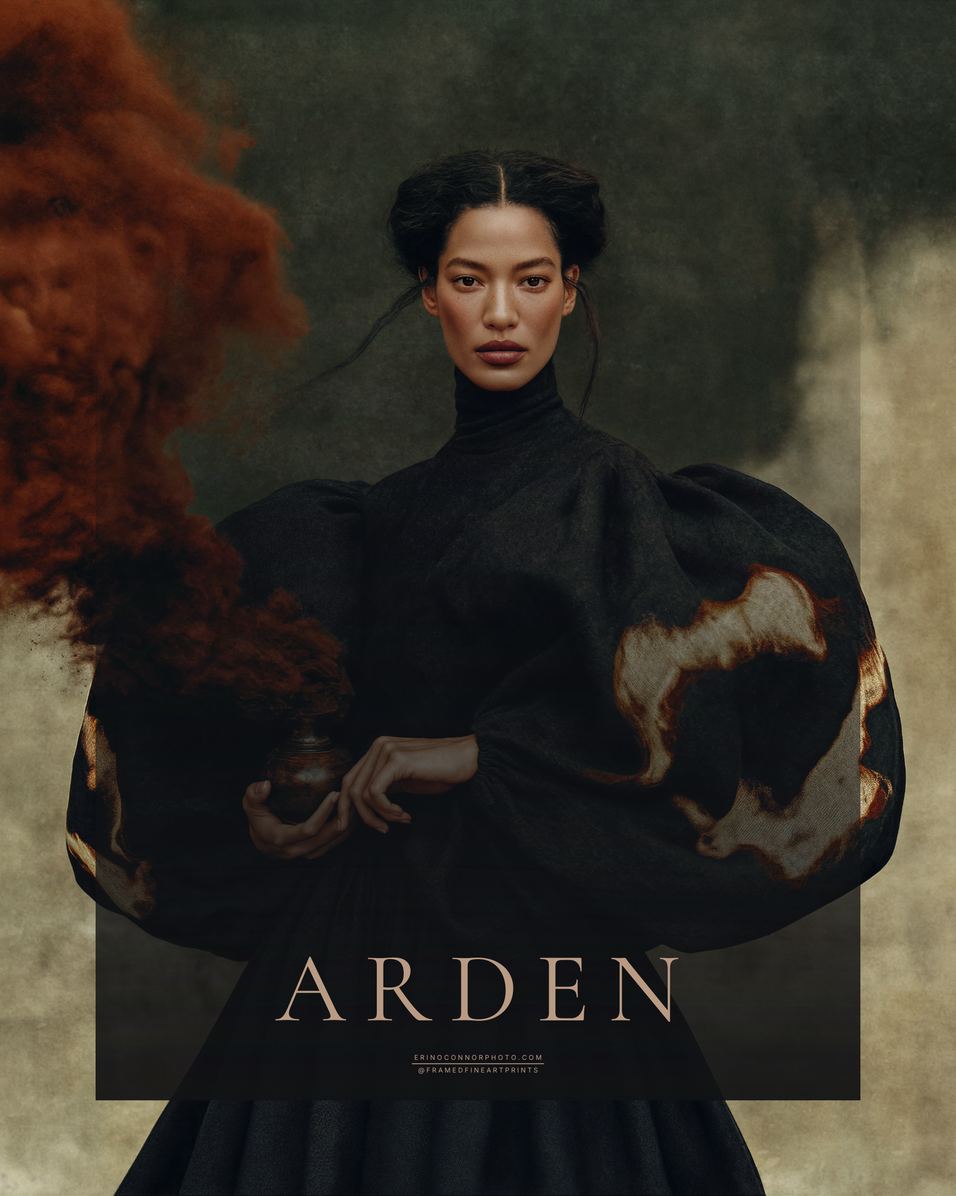 Arden fine art portrait of a dark haired woman in a voluminous black garment with rust and ivory patterned sleeves, holding a small vessel beneath a large rust colored plume.