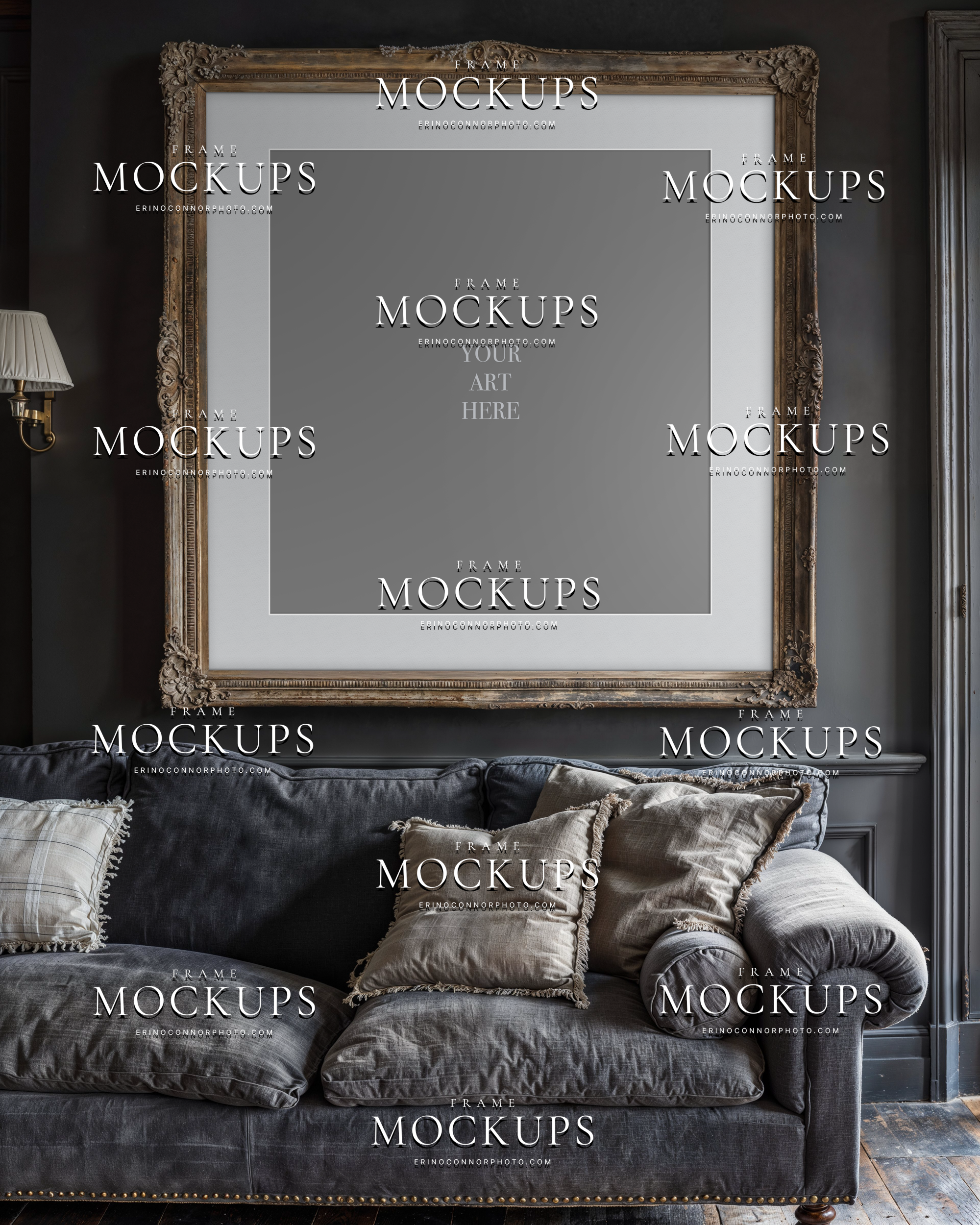 Empty vertical wall art mockup in a moody vintage living room with charcoal walls, grey sofa, oversized antique frame, and soft atmospheric light