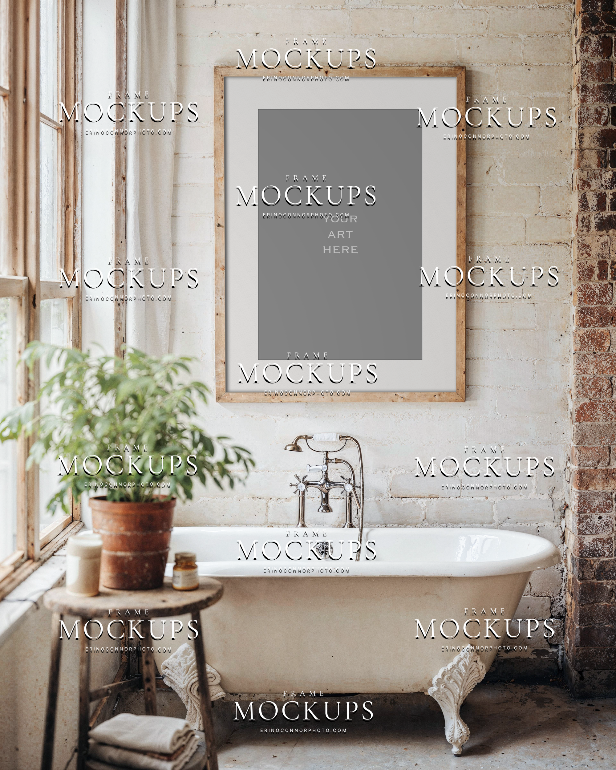 Cottage farmhouse bathroom frame mockup above vintage clawfoot tub, light wood frame on white brick wall by tall window, rustic stool and plant, airy neutral spa styling