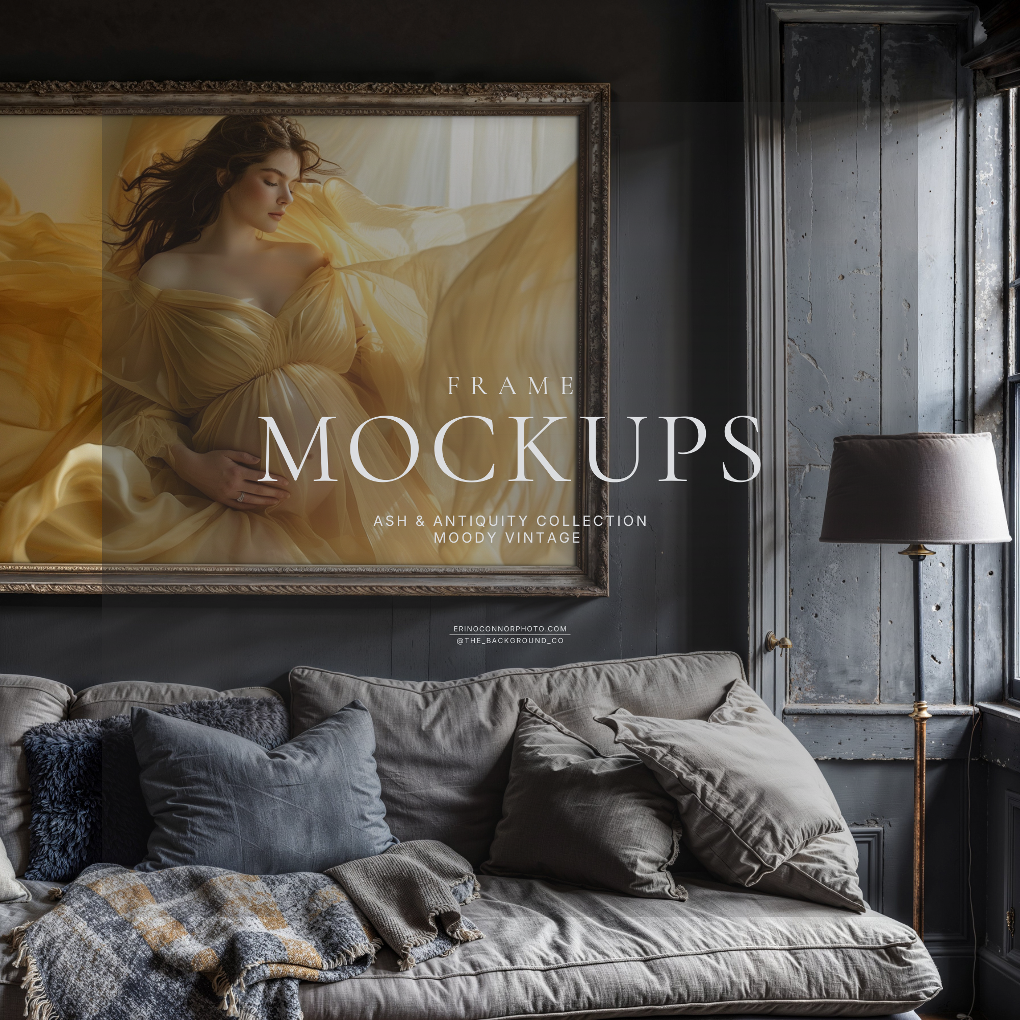 Moody Vintage grey living room frame mockup with a wide horizontal antique gold frame and white mat above a plush grey sofa, window light and floor lamp, for showcasing artwork.