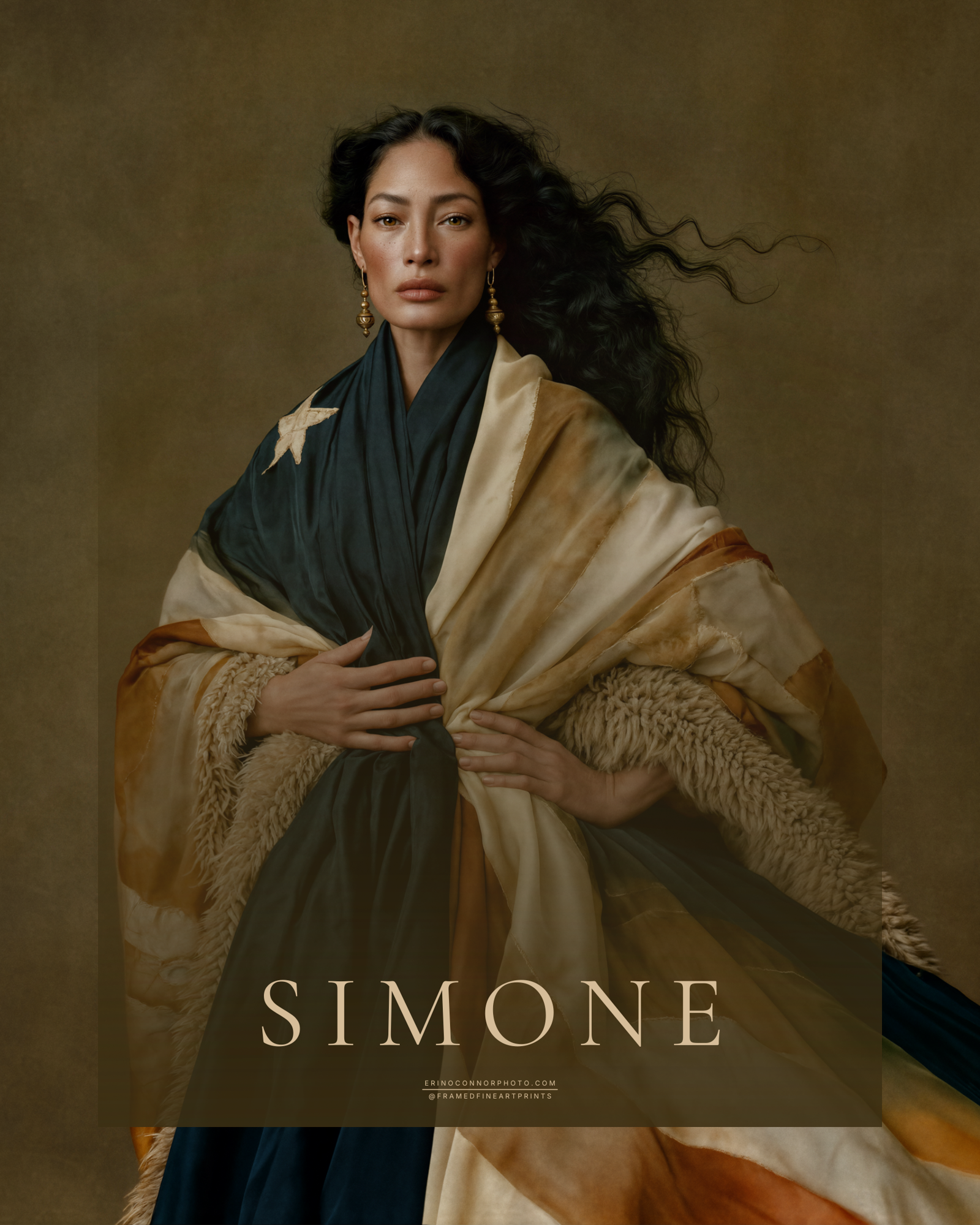 Simone fine art portrait of a dark haired woman draped in an aged flag like textile in deep blue, cream, ochre and muted rust.