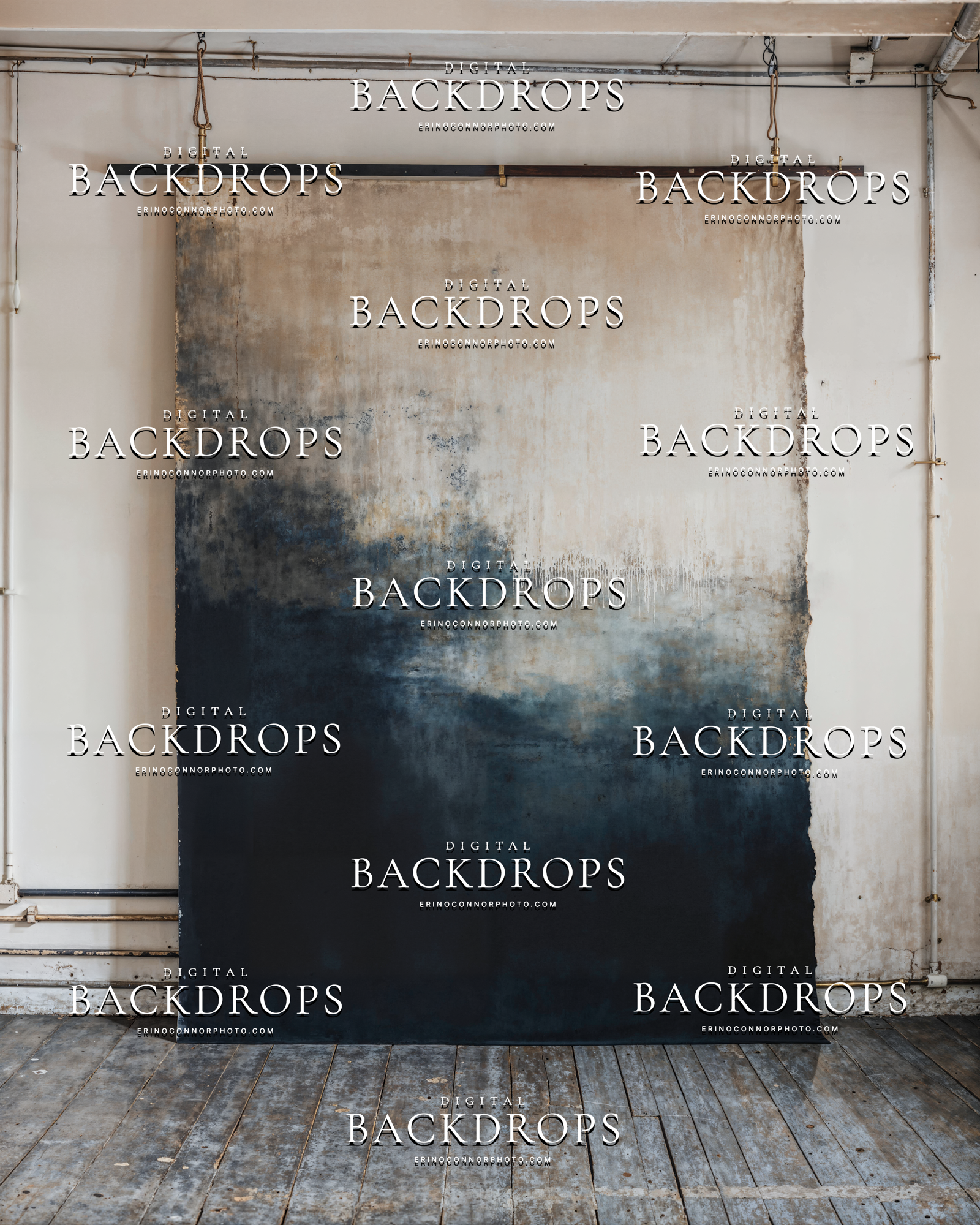 Vertical painterly canvas backdrop in a white industrial studio, beige and navy tones, brass pipe details, worn walls and wood floor, neutral fine art background.