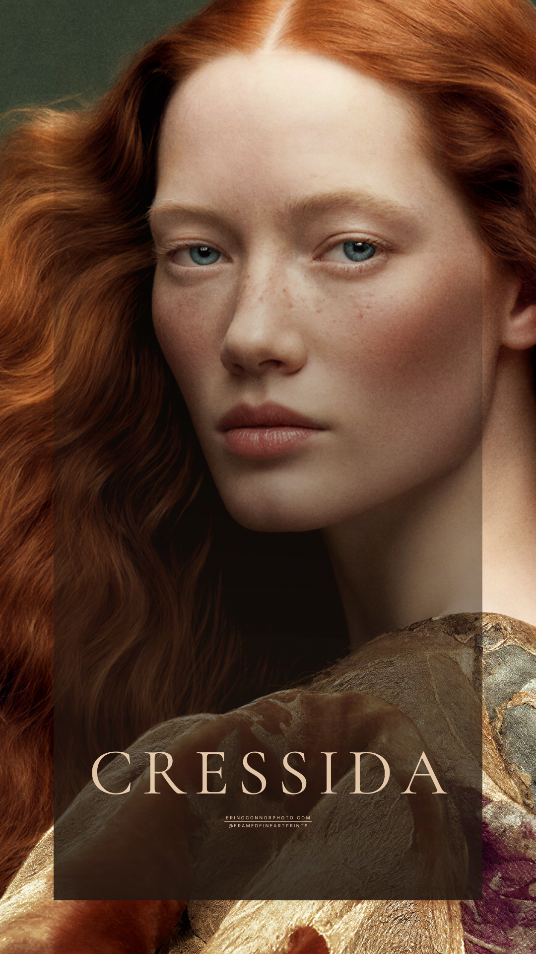 Close portrait of Cressida with pale freckled skin, blue eyes and long voluminous copper-red hair.