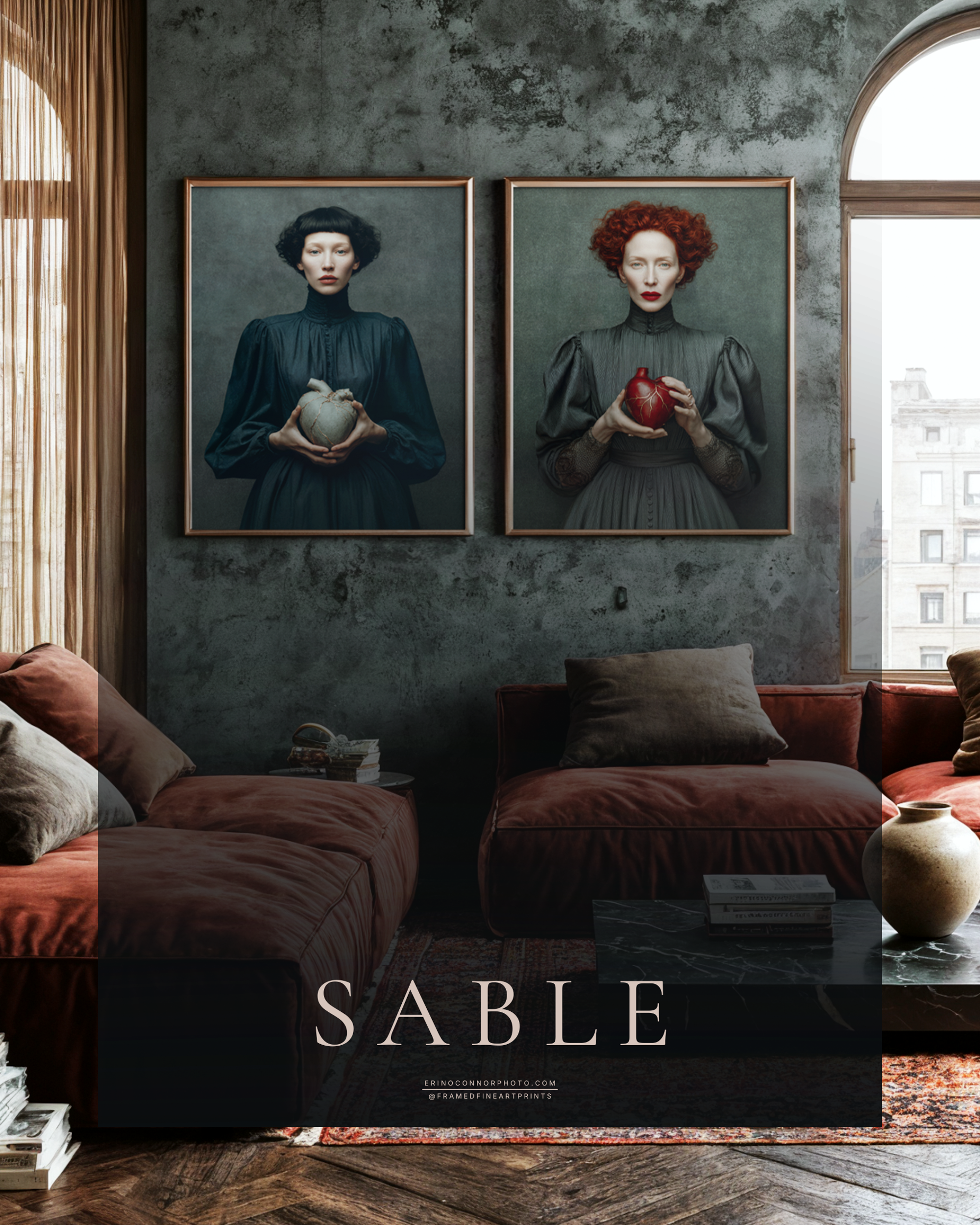 Framed companion portraits of Sable and Cinder displayed together above rust velvet seating in a moody contemporary living room.