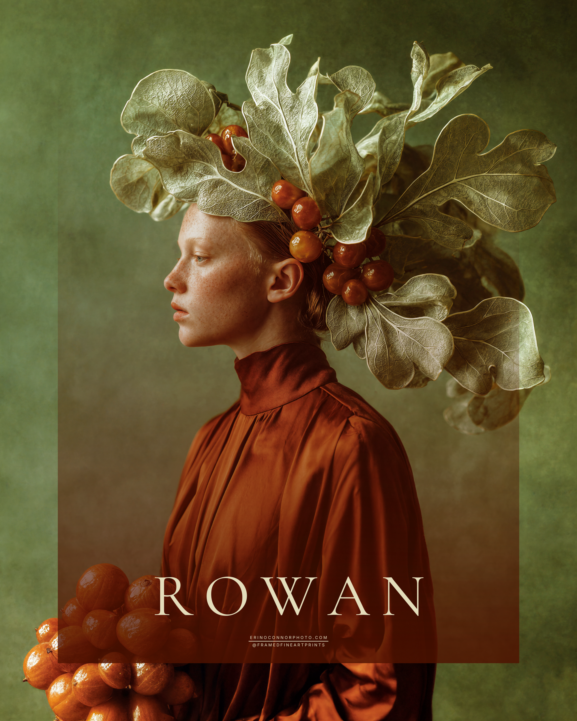 Rowan fine art portrait of a red-haired woman in a rust-colored garment wearing an elaborate headdress of fig leaves and warm-toned fruit.