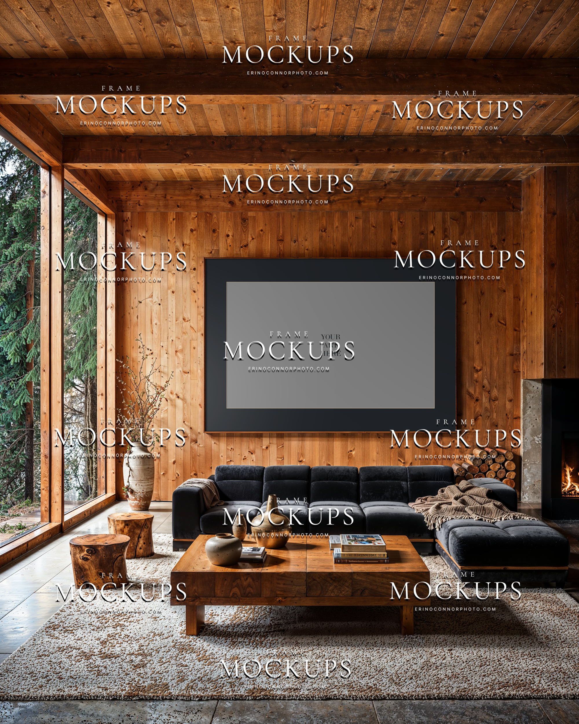 Rustic modern horizontal frame mockup in a wood clad living room with black sectional sofa, large picture window, fireplace, and warm cabin styling