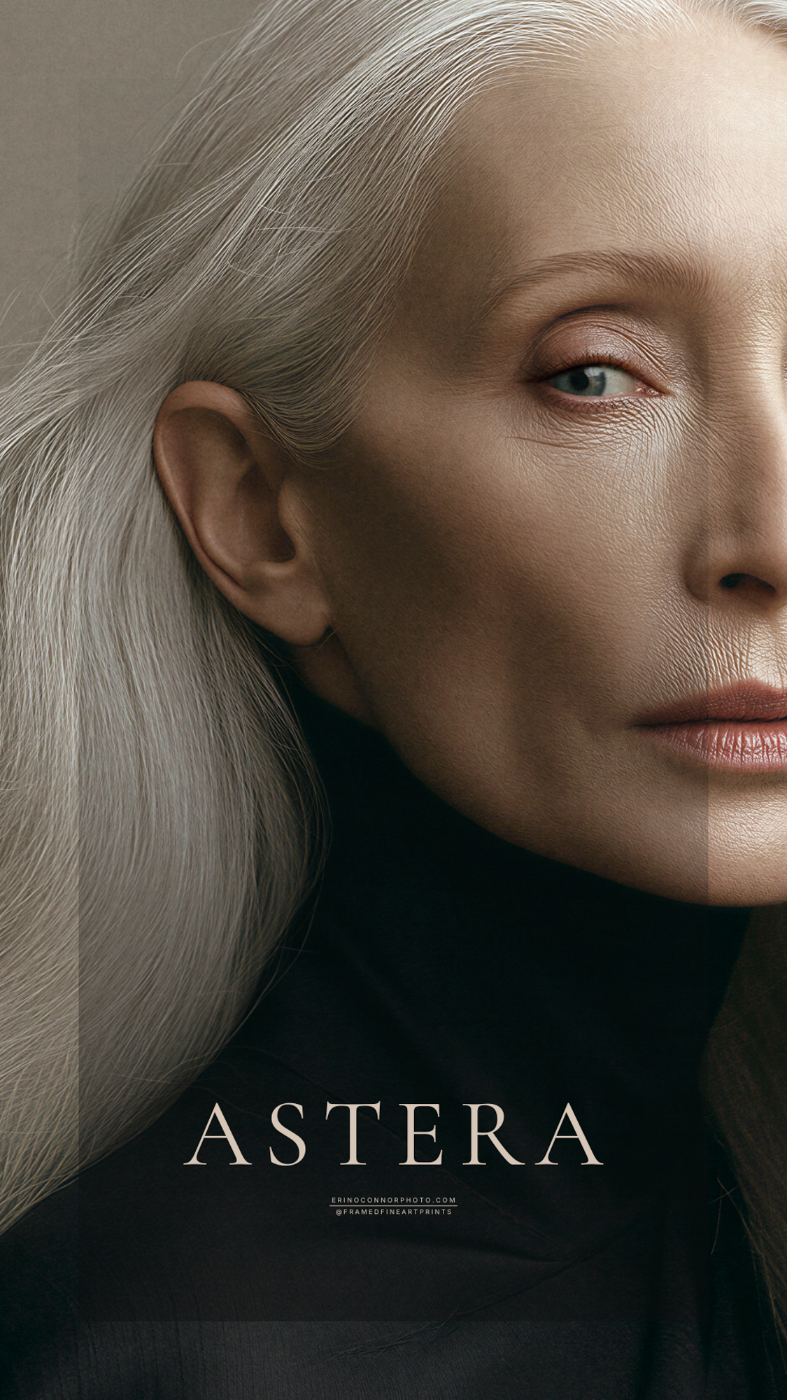 Close portrait of Astera with long silver hair, blue-green eyes and naturally textured mature skin.
