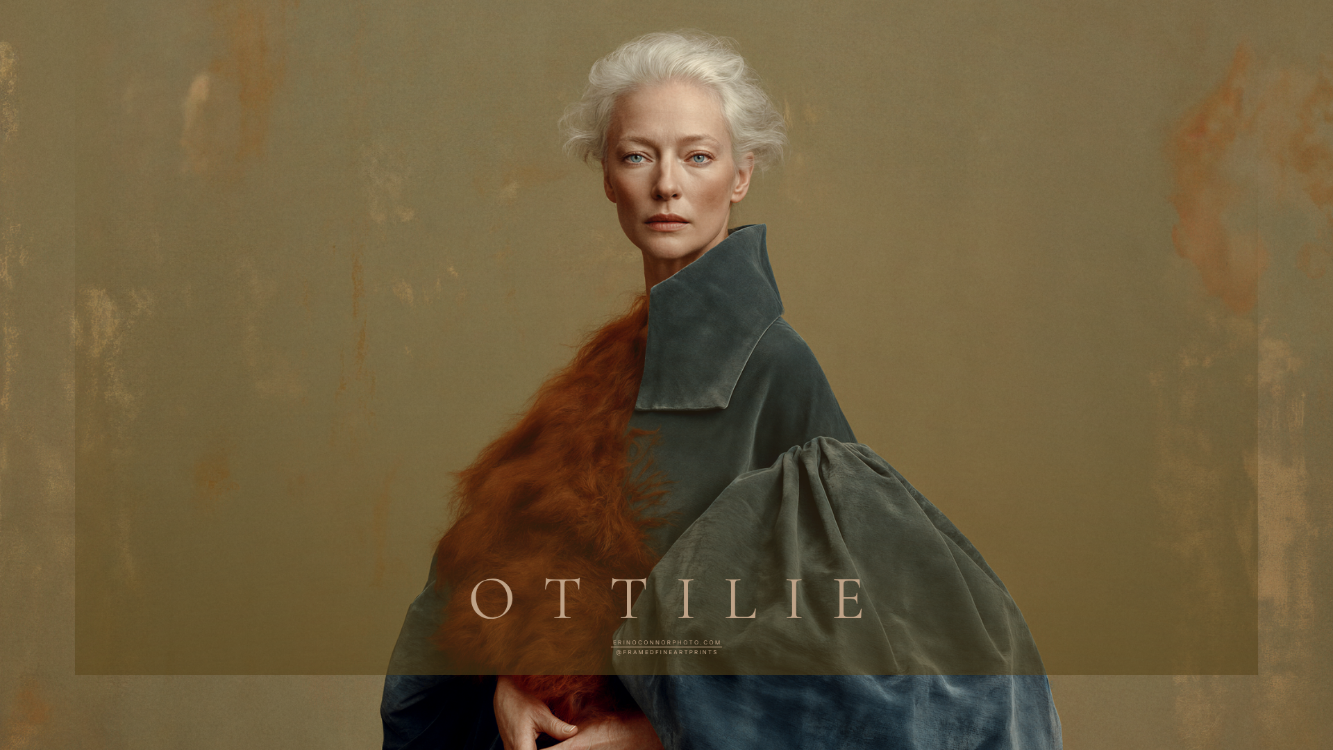Horizontal portrait of Ottilie, a silver-haired woman in an oversized teal garment with rust-colored textile detail against a warm ochre background.