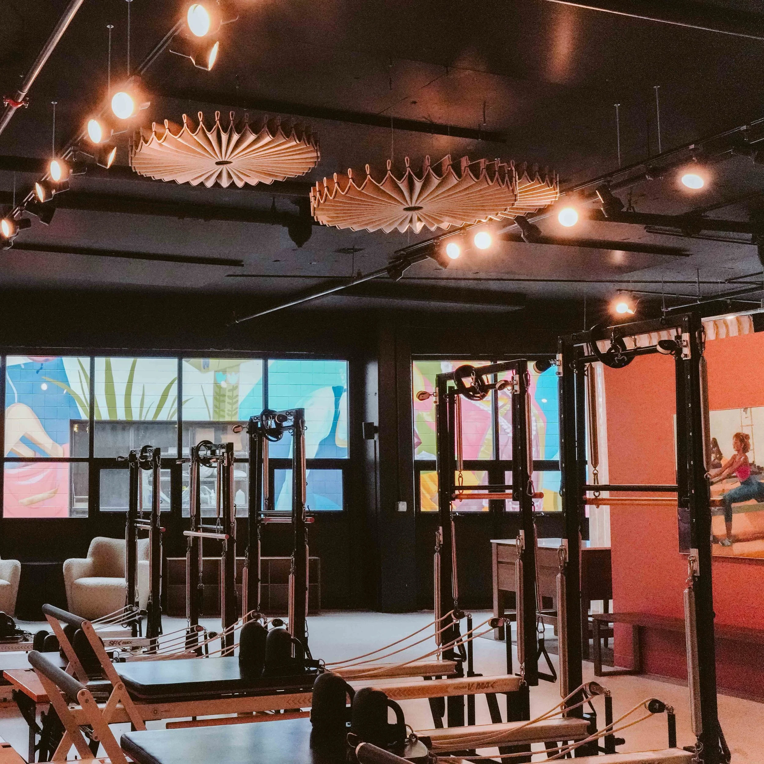 We designed our studio to look and feel like a living room. Yes, it&rsquo;s a space to workout, but it&rsquo;s also a space to connect, unwind, and simply enjoy. The walls are adorned with beautiful pieces of art by our very own @kirstentradowsky. Ou