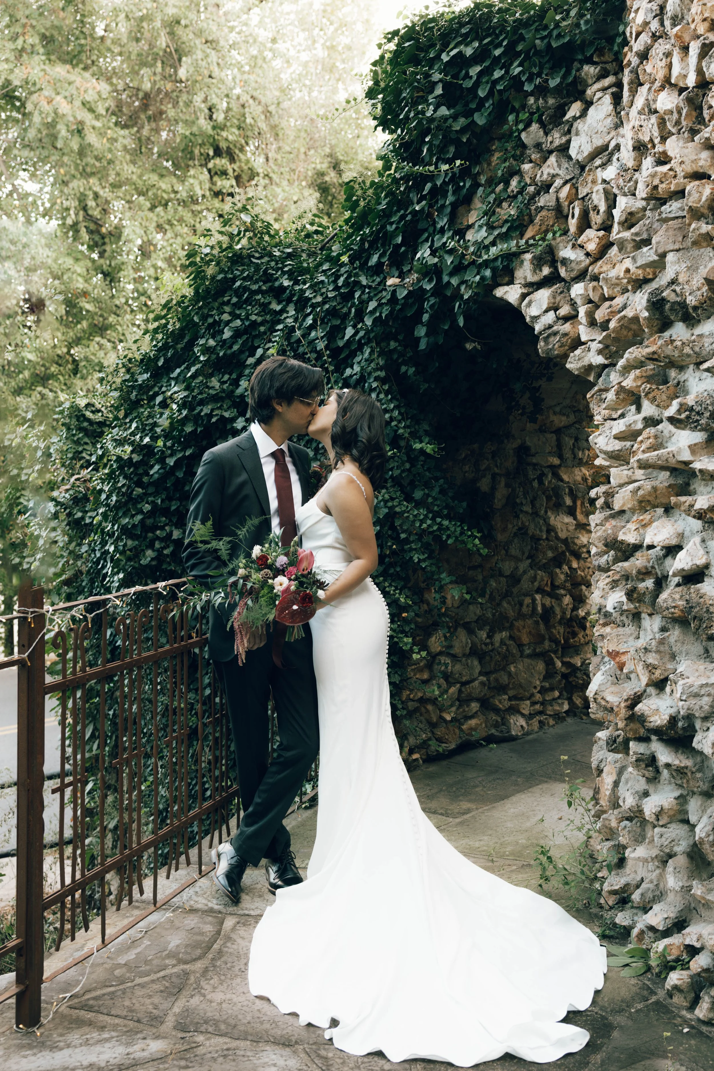 couple kissing wedding day