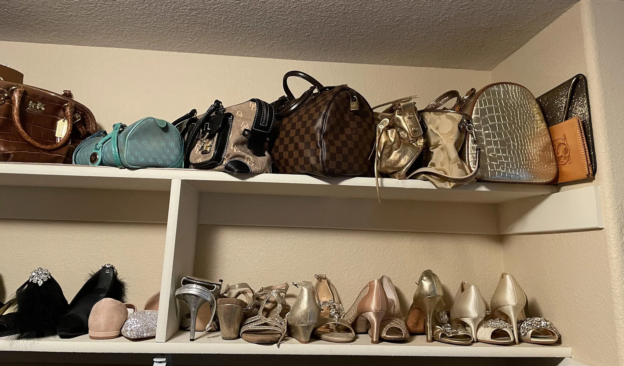 Walk-in Closet organized  designer bags and heels