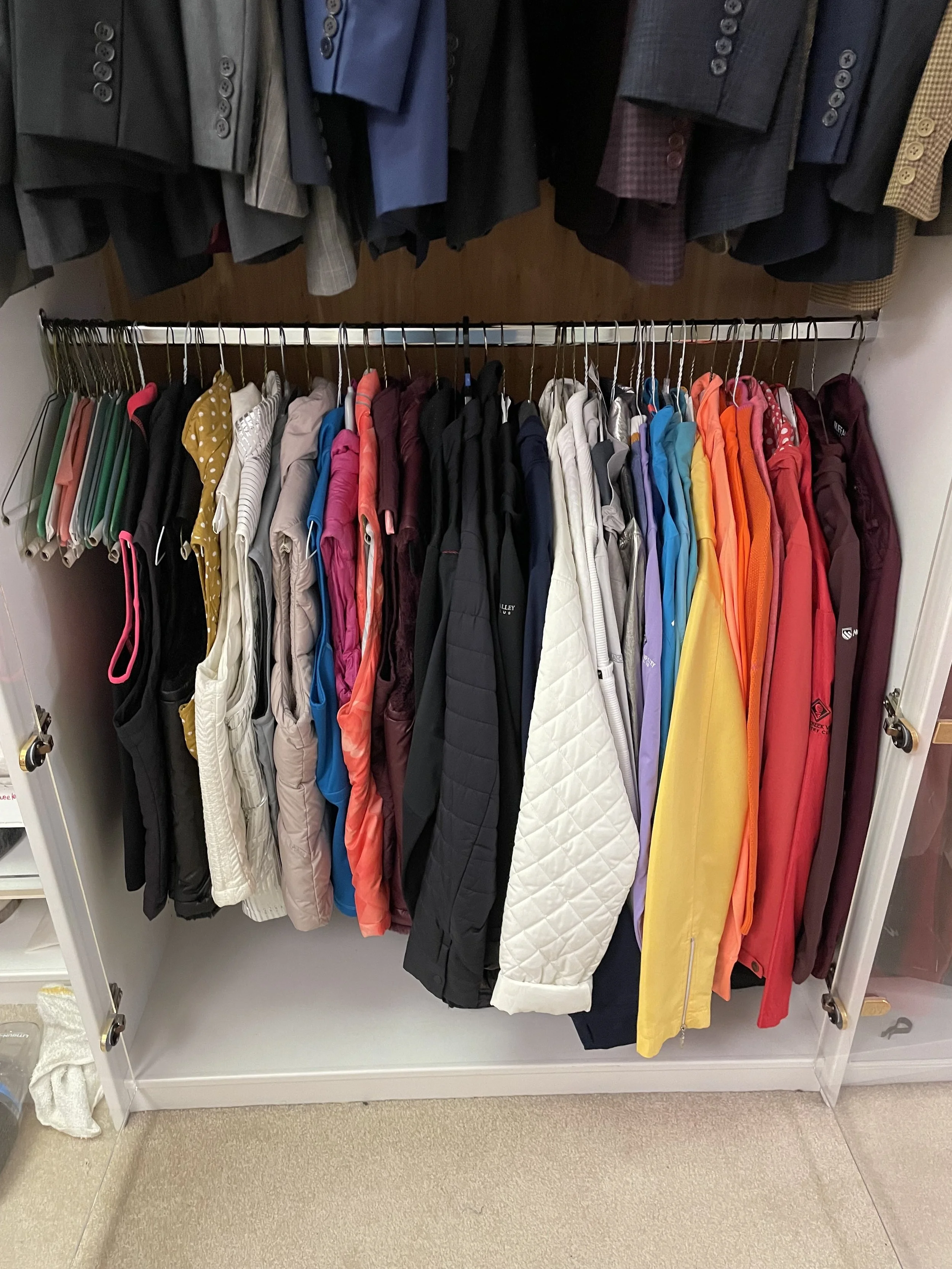 Walk-in Closet Golfing gear wear organized in closet