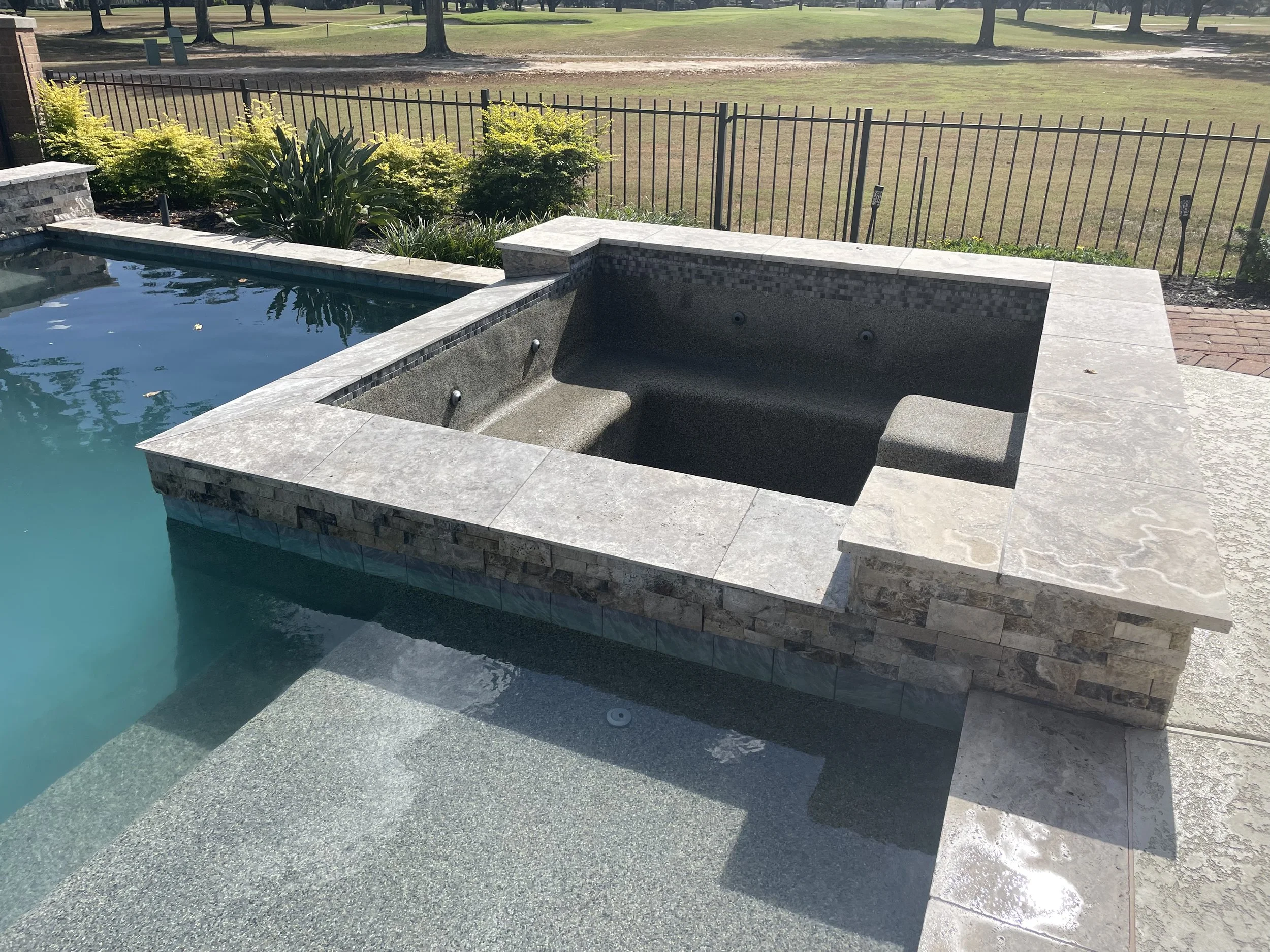 The same spa finished in travertine