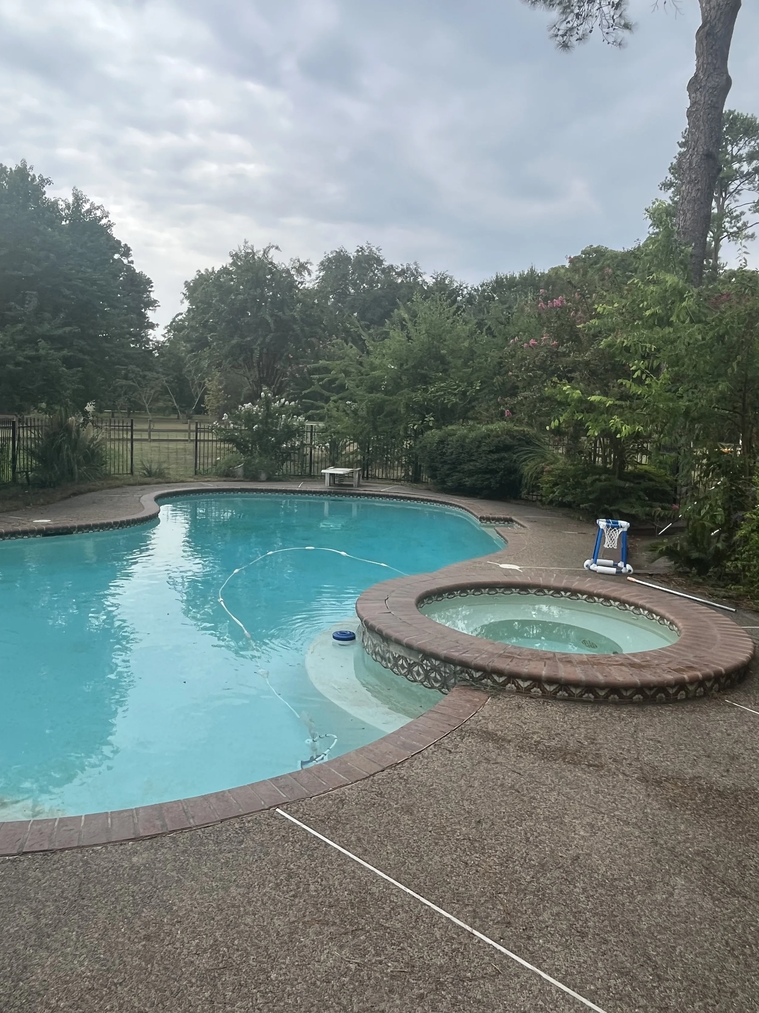 Old brick coping and dated spa before renovation