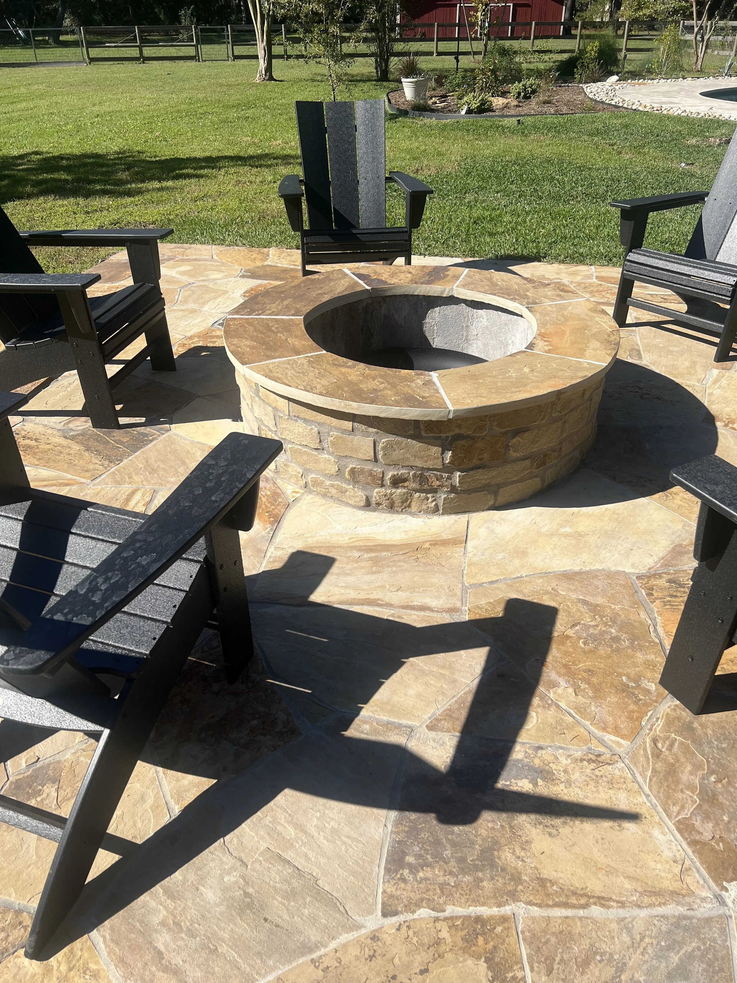 Stone firepit built into the new flagstone deck