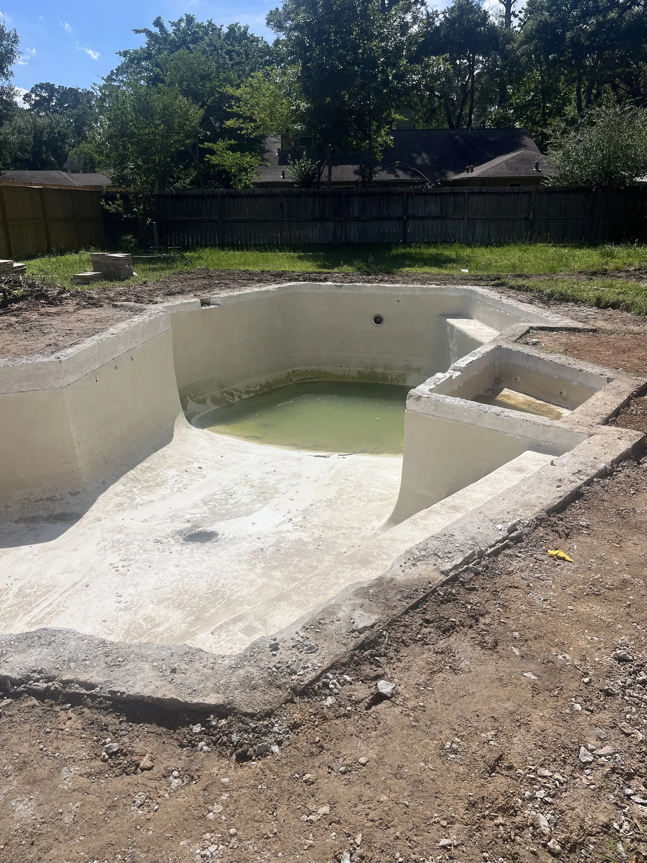 Empty gunite shell before resurfacing