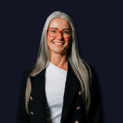 Headshot of Bex O’Malley, ADHD coach and neurodiversity consultant, smiling against a neutral background.