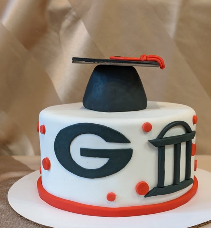 Grad cap, G, and arches cake