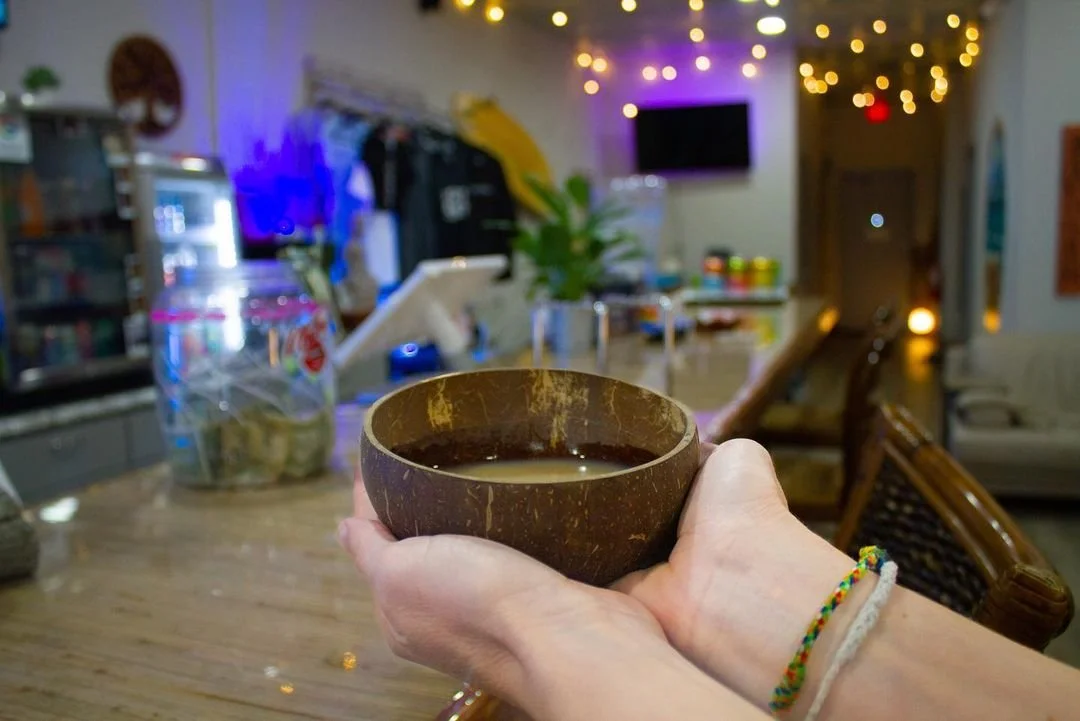 Kava Shell in hand at Island Vibes Lake Worth Kava Bar