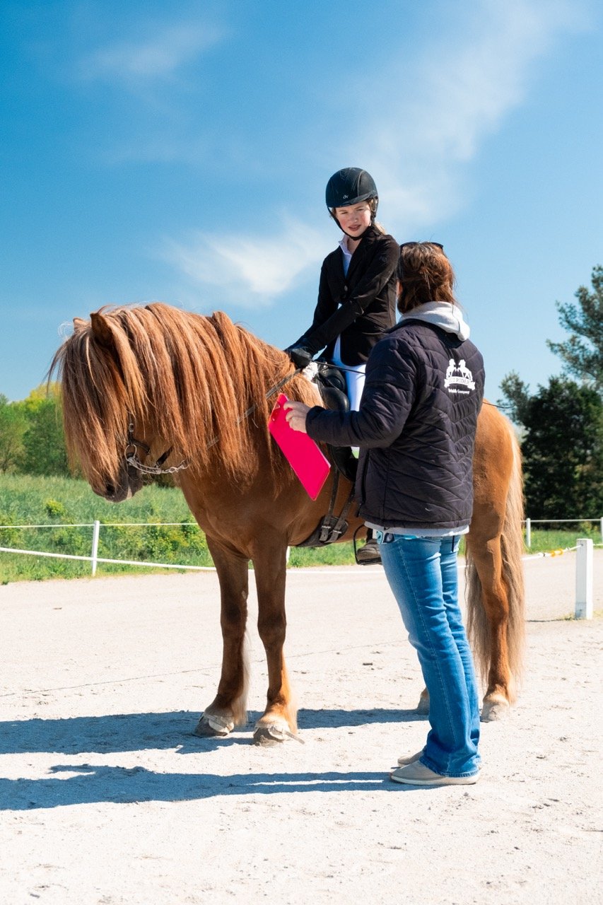 Our student, Greta, getting feedback from the judge before she gets her ribbon! ❤️